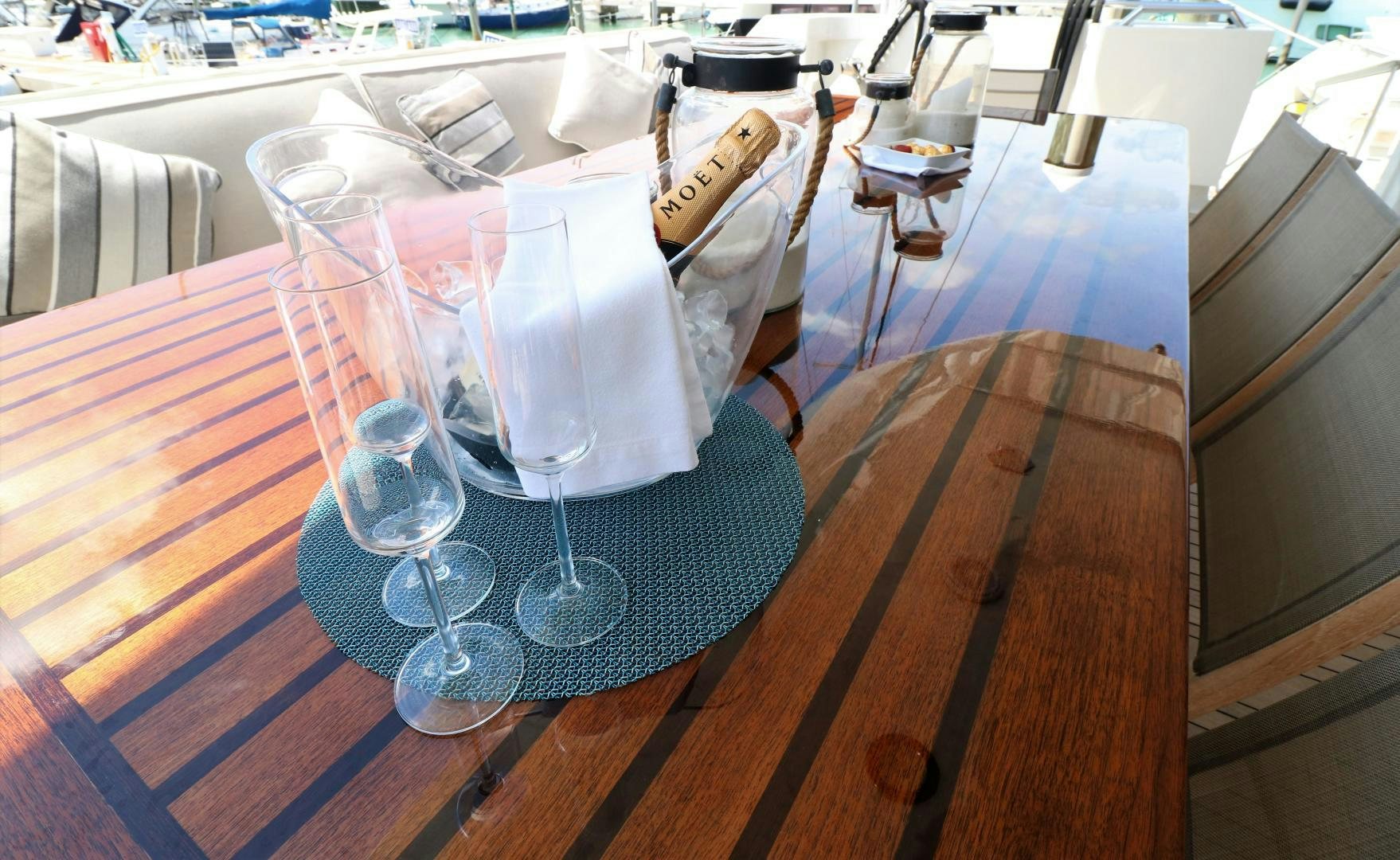 a group of wine glasses on a table aboard No Name Yacht for Sale