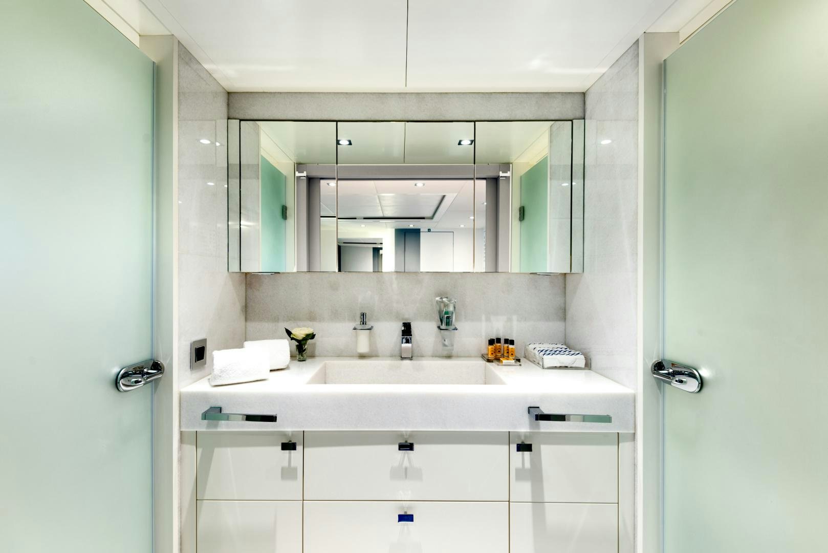 a bathroom with a large mirror aboard CURFEW II Yacht for Sale