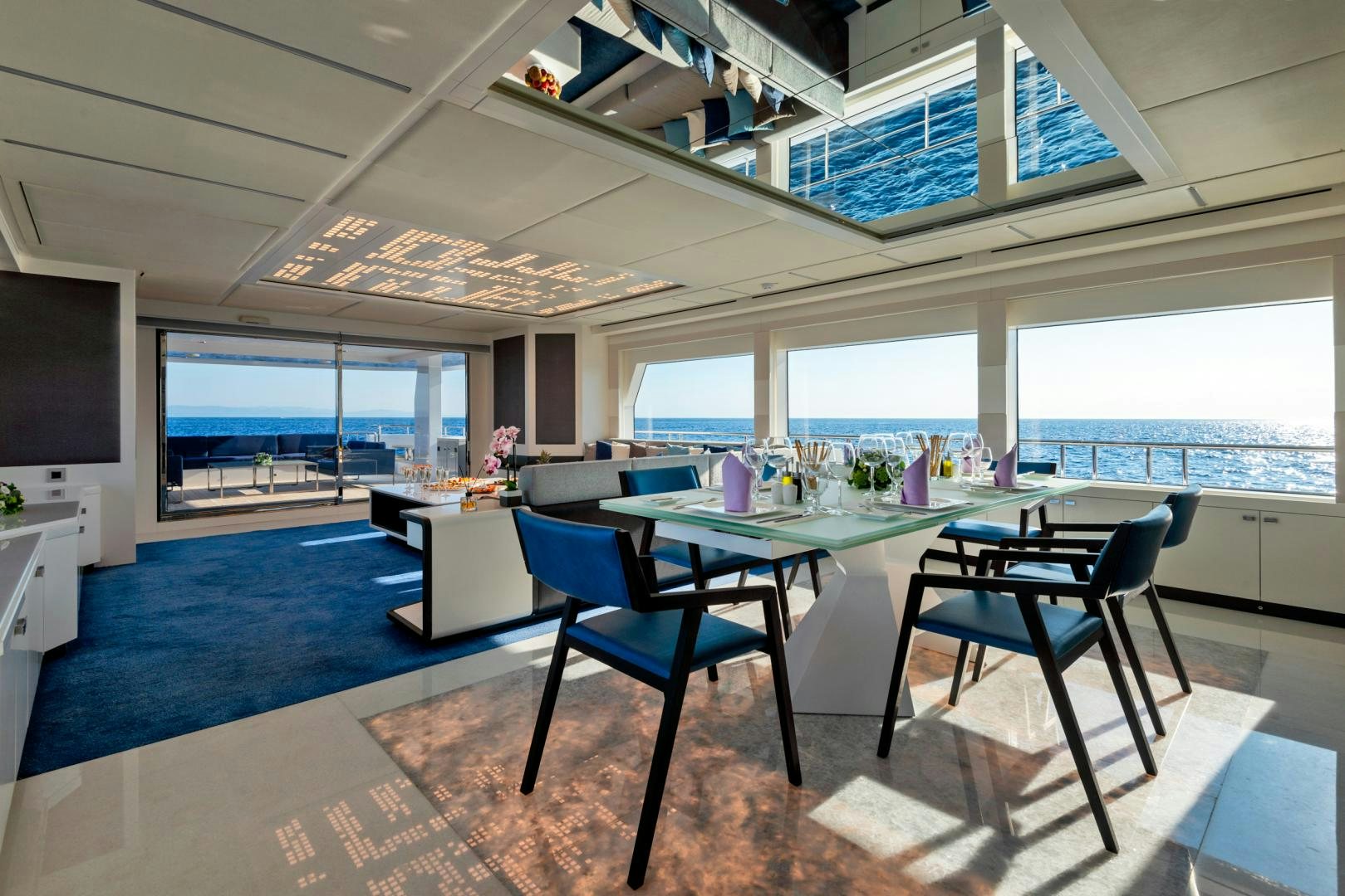 a room with a table and chairs aboard CURFEW II Yacht for Sale