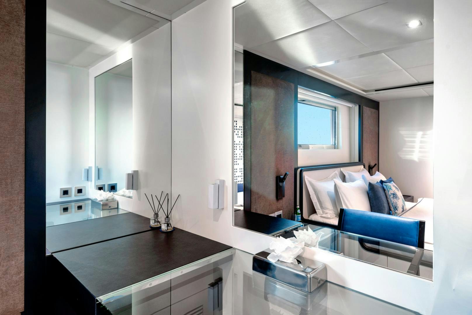 a room with a bed and a desk aboard CURFEW II Yacht for Sale