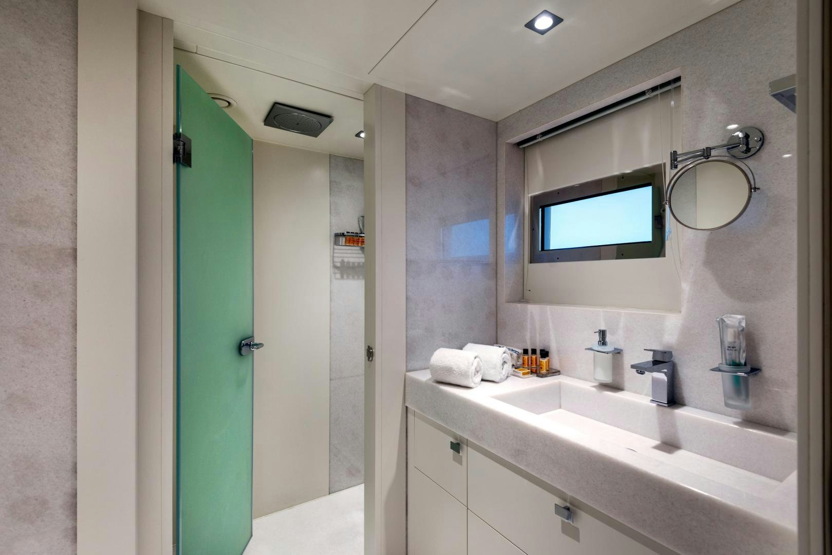 a bathroom with a sink and a mirror aboard CURFEW II Yacht for Sale