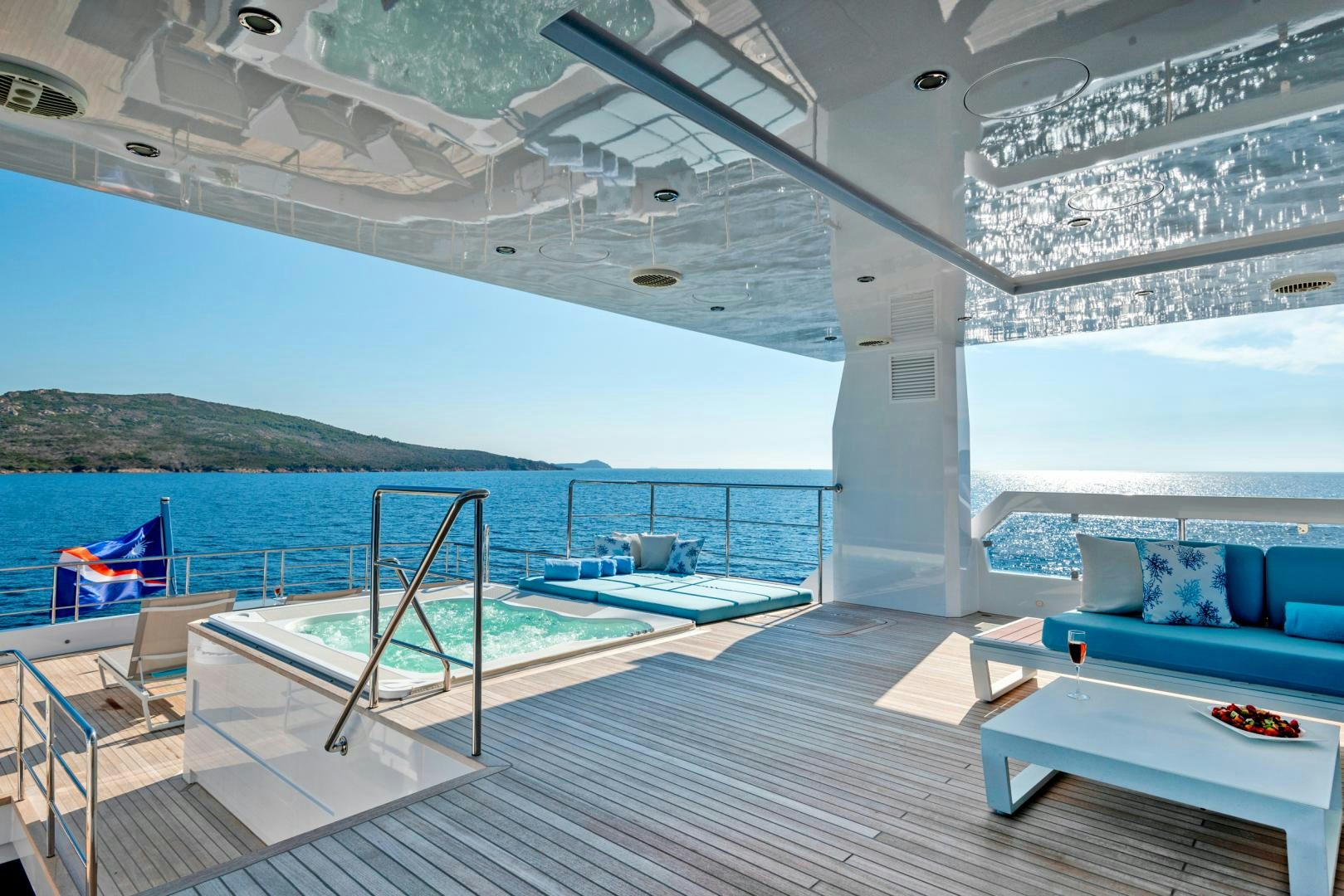 a large pool with a deck aboard CURFEW II Yacht for Sale
