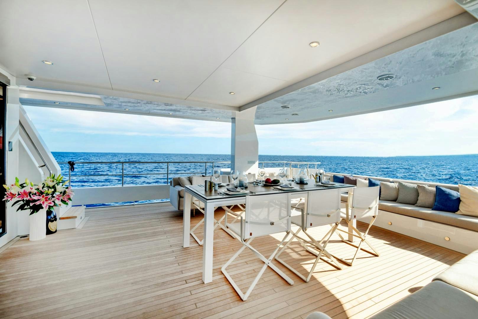 a room with a table and chairs aboard CURFEW II Yacht for Sale