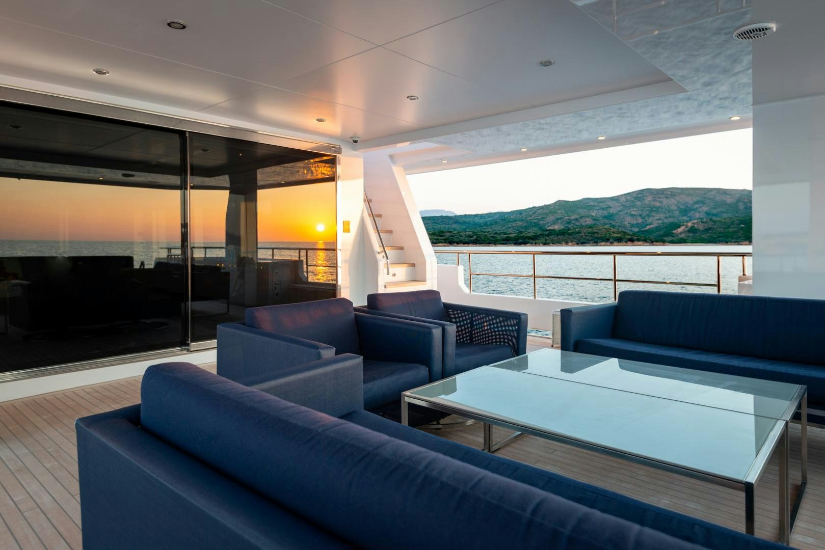 a room with a table and couches aboard CURFEW II Yacht for Sale