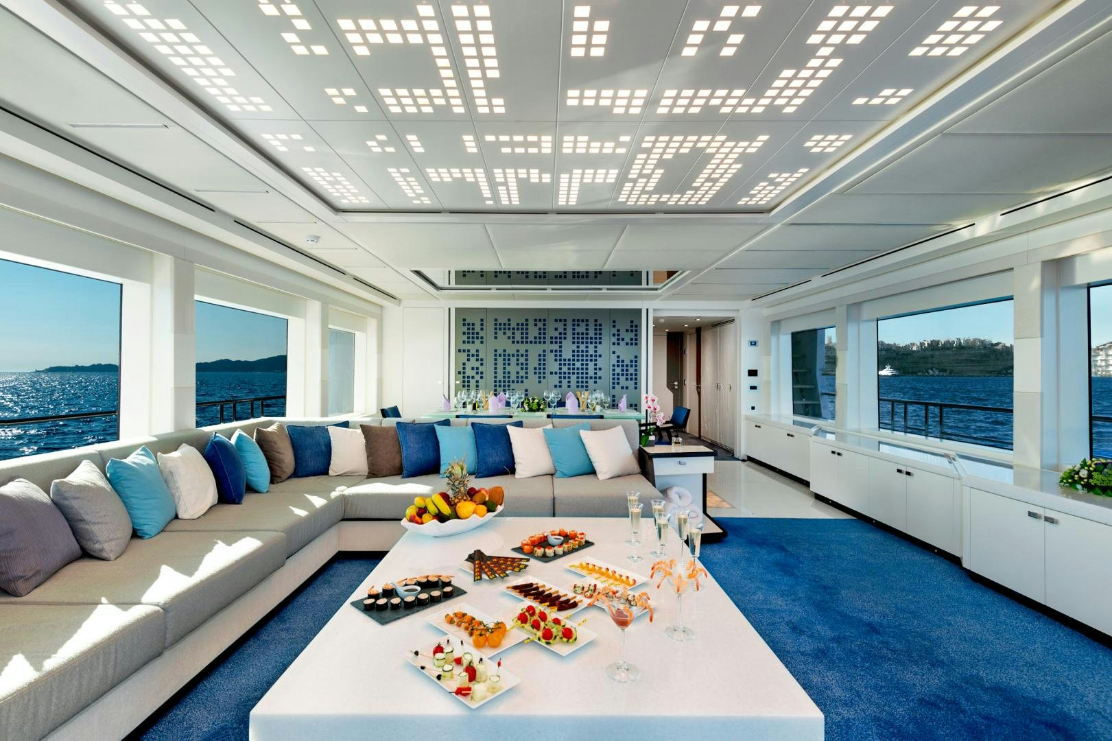 a living room with a large table aboard CURFEW II Yacht for Sale