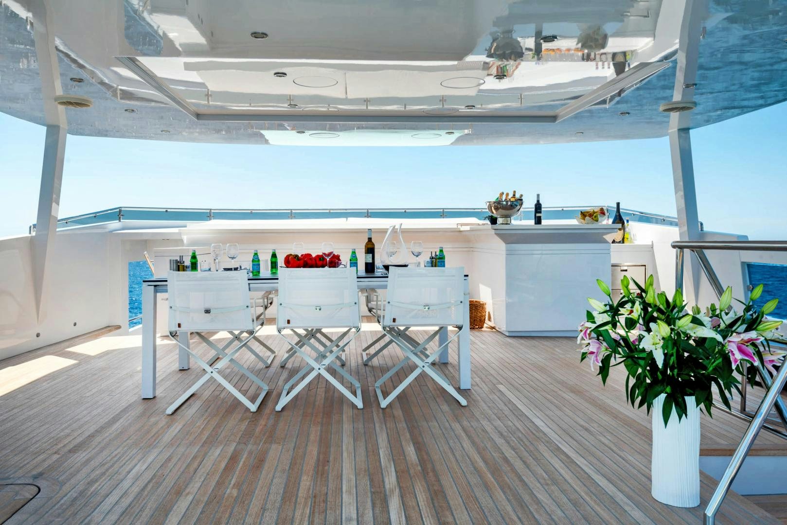 a room with tables and chairs aboard CURFEW II Yacht for Sale