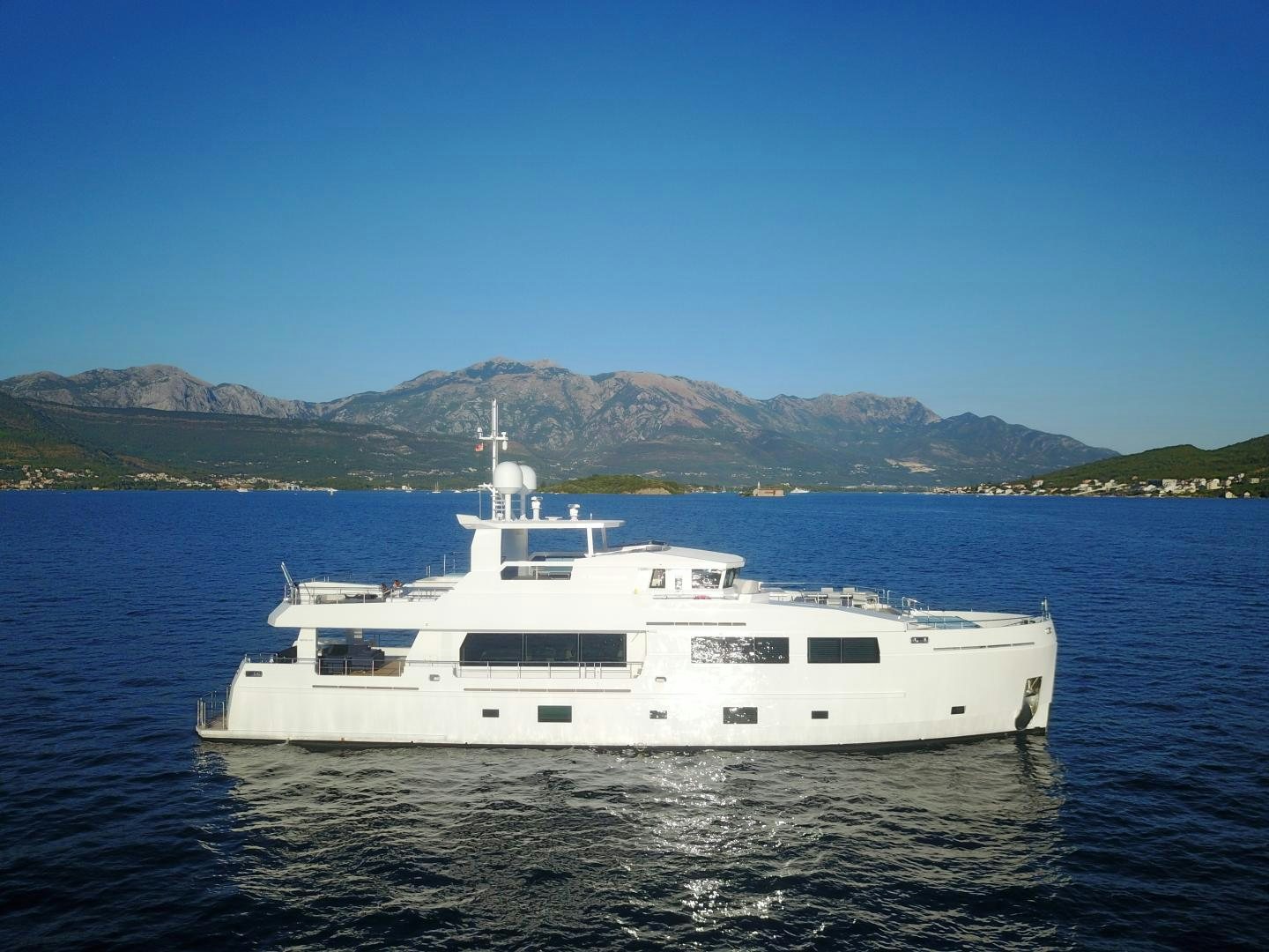 a white yacht in the water aboard CURFEW II Yacht for Sale