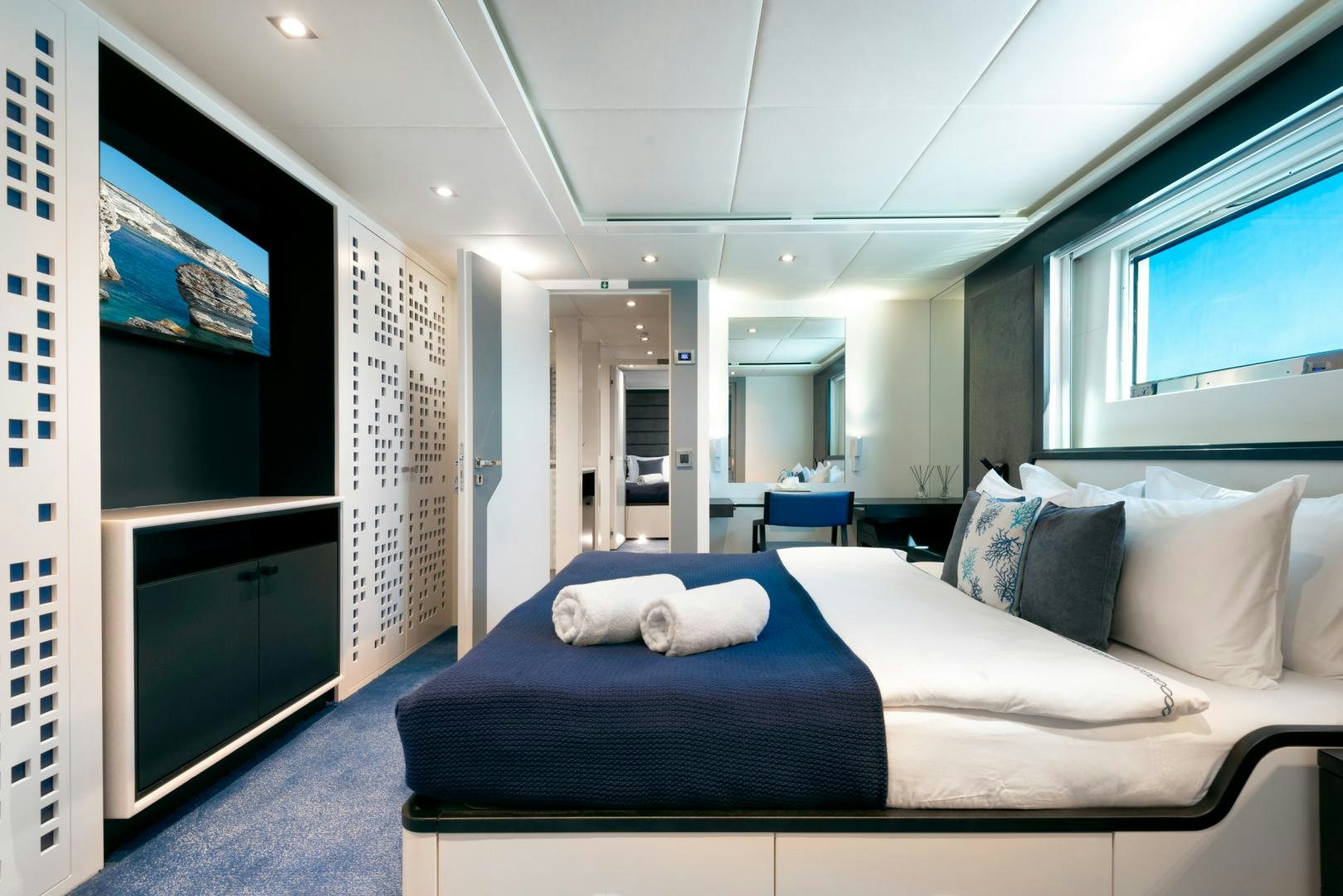 a large bedroom with a large bed aboard CURFEW II Yacht for Sale