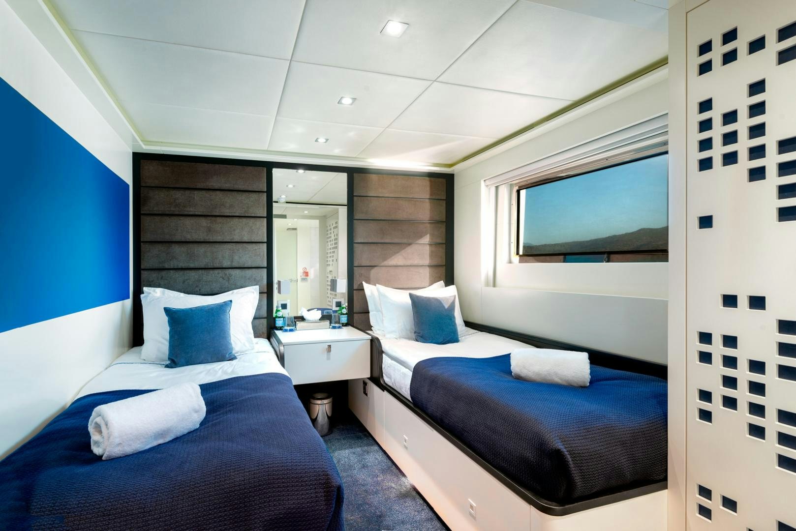 a room with a couple beds aboard CURFEW II Yacht for Sale