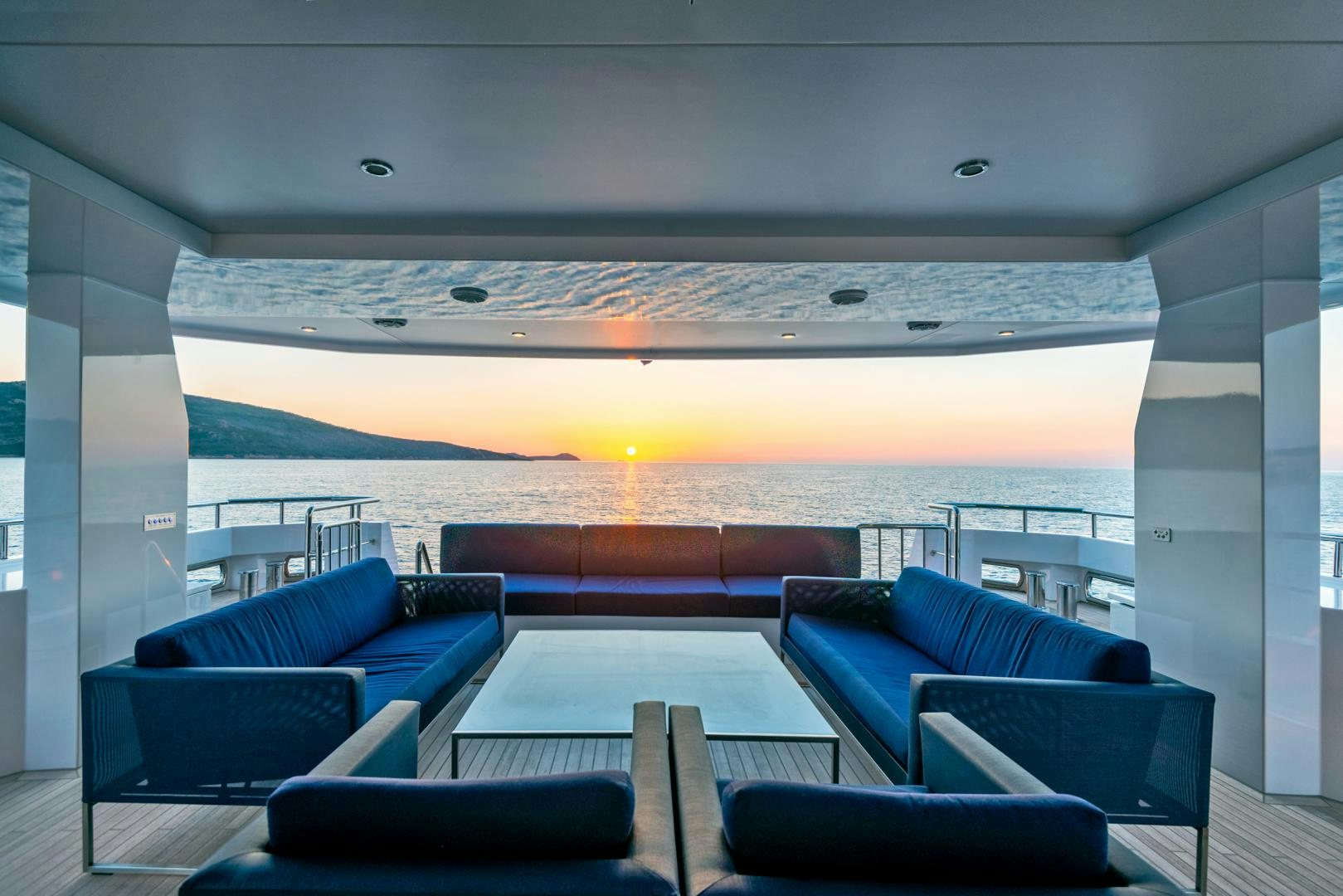 a room with a view of the sunset and the ocean aboard CURFEW II Yacht for Sale
