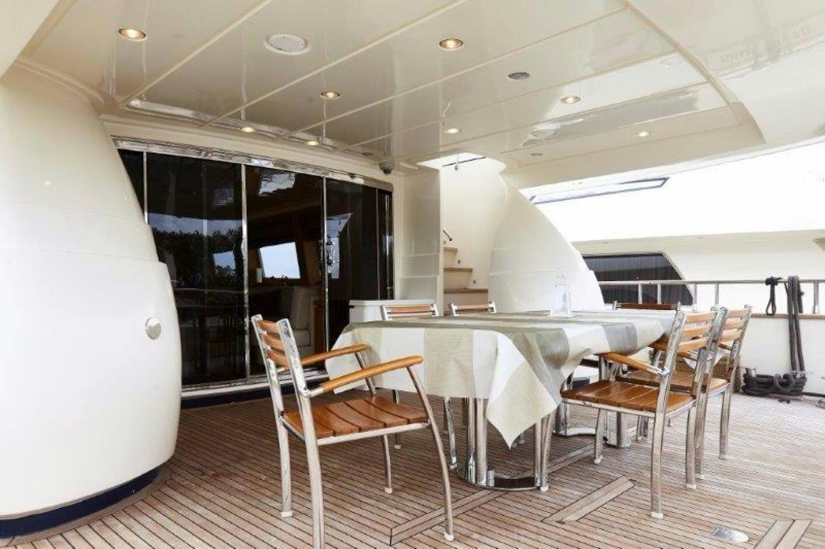 a room with tables and chairs aboard YASSON Yacht for Sale