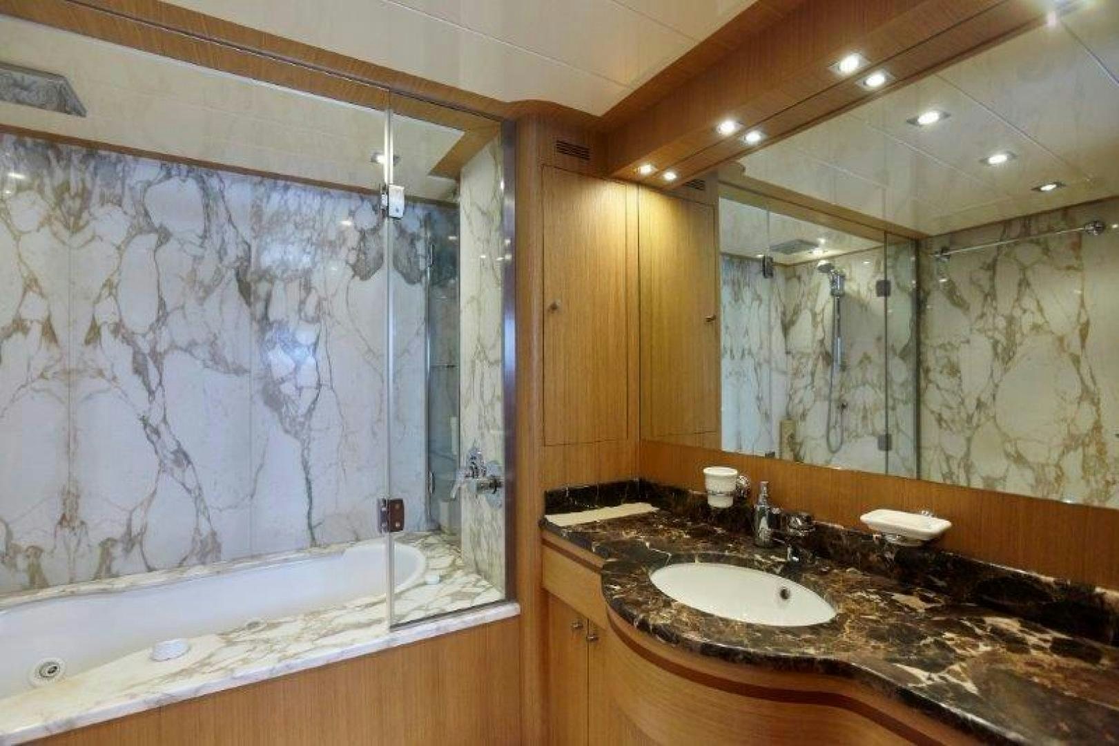 a bathroom with a large bathtub and a sink aboard YASSON Yacht for Sale