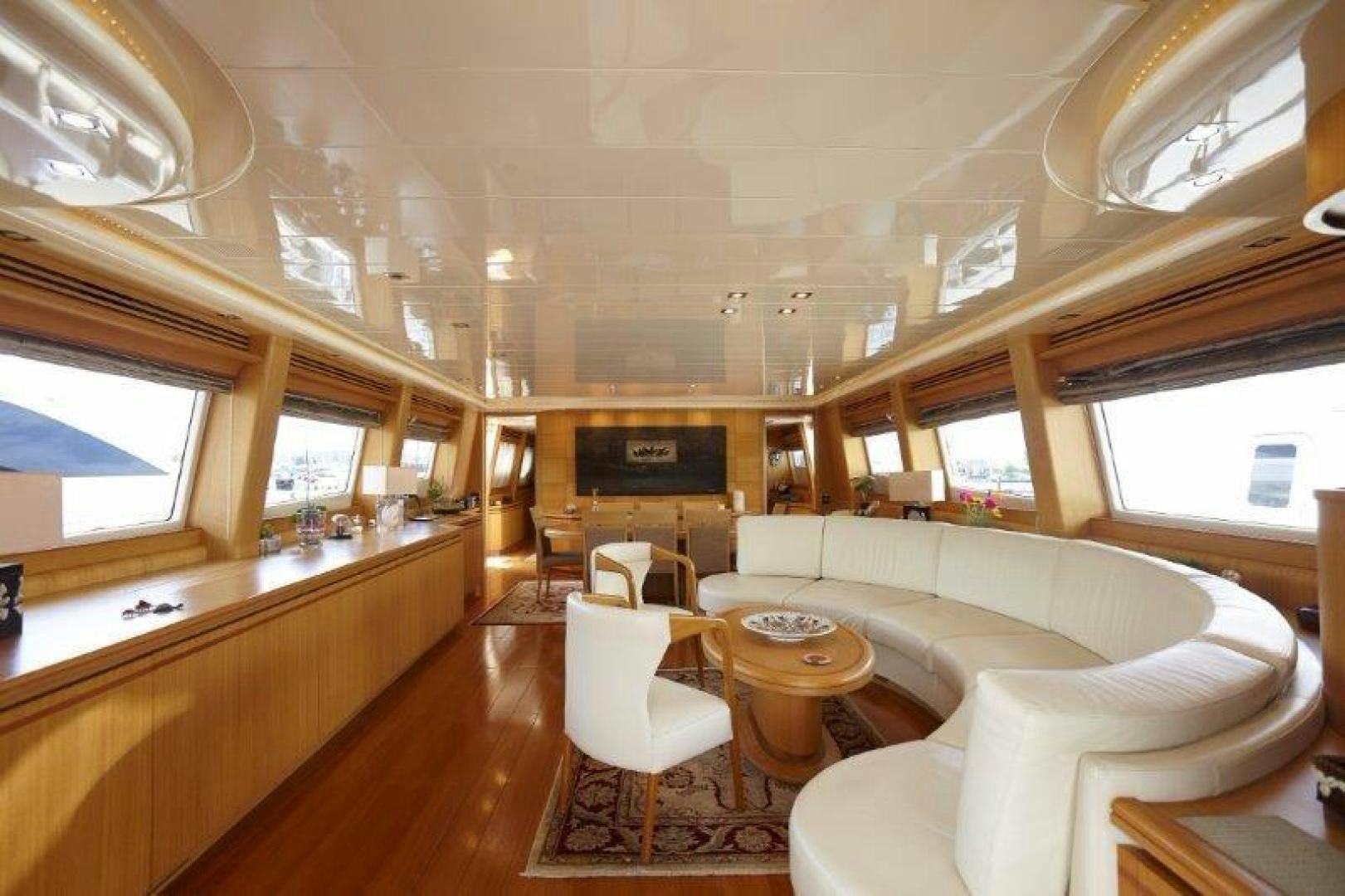 a large room with a couch and a table aboard YASSON Yacht for Sale