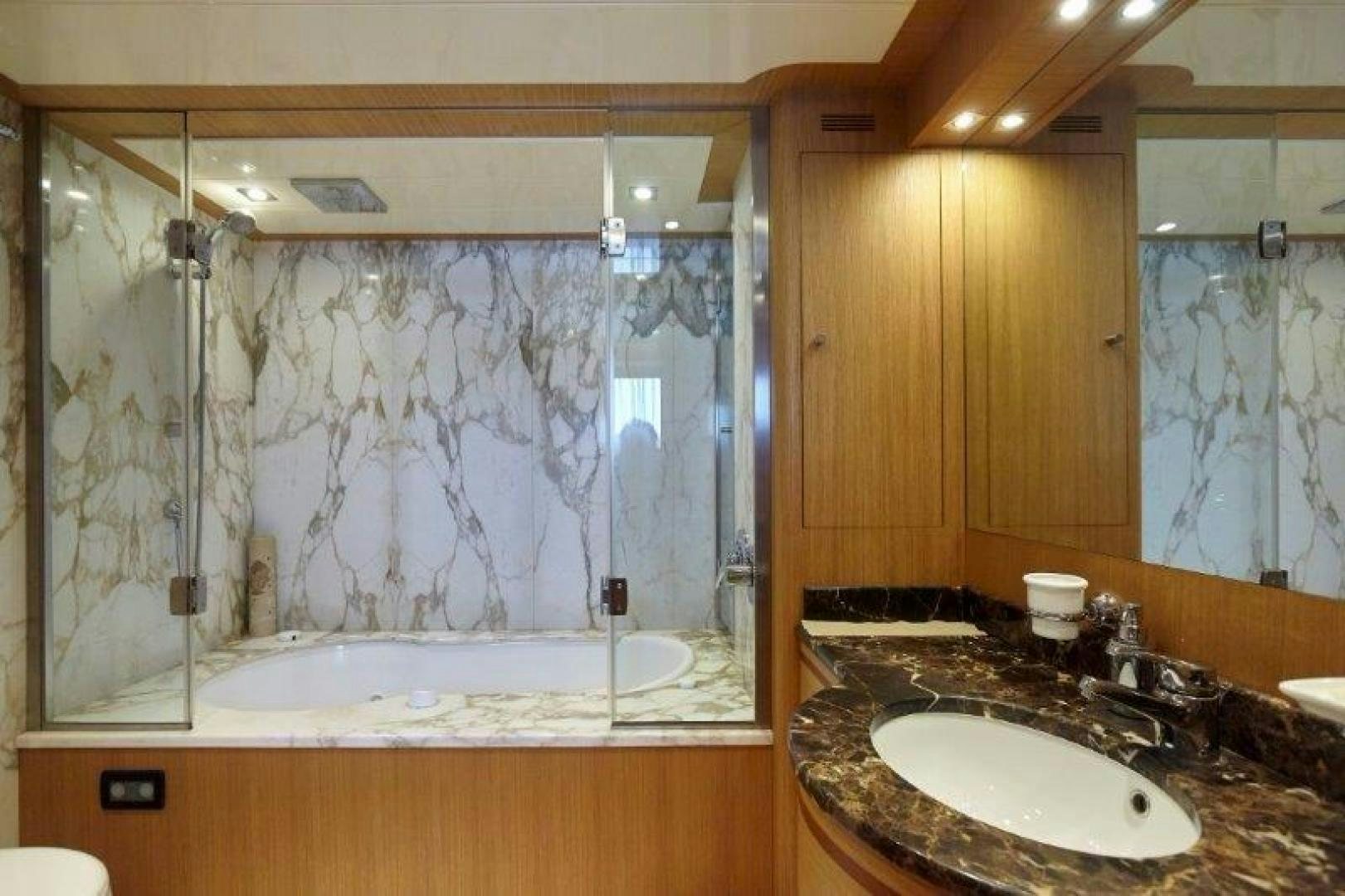 a bathroom with a large shower curtain aboard YASSON Yacht for Sale
