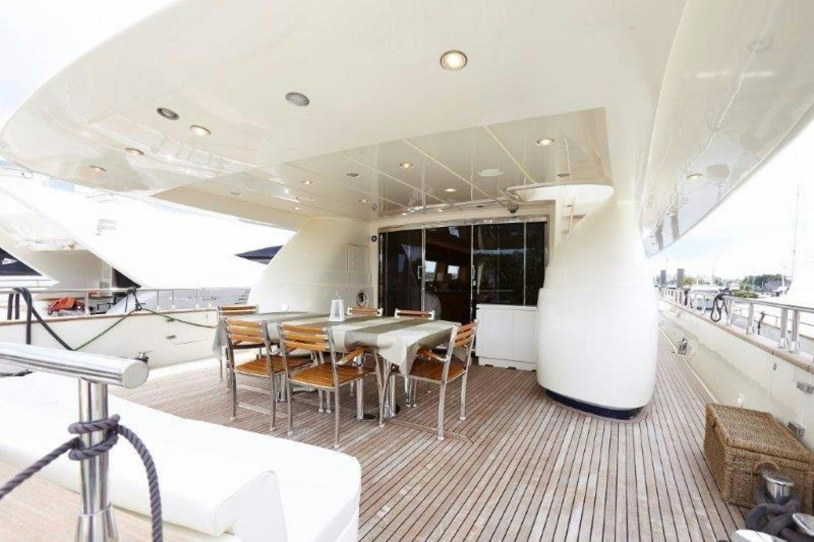 a room with tables and chairs aboard YASSON Yacht for Sale