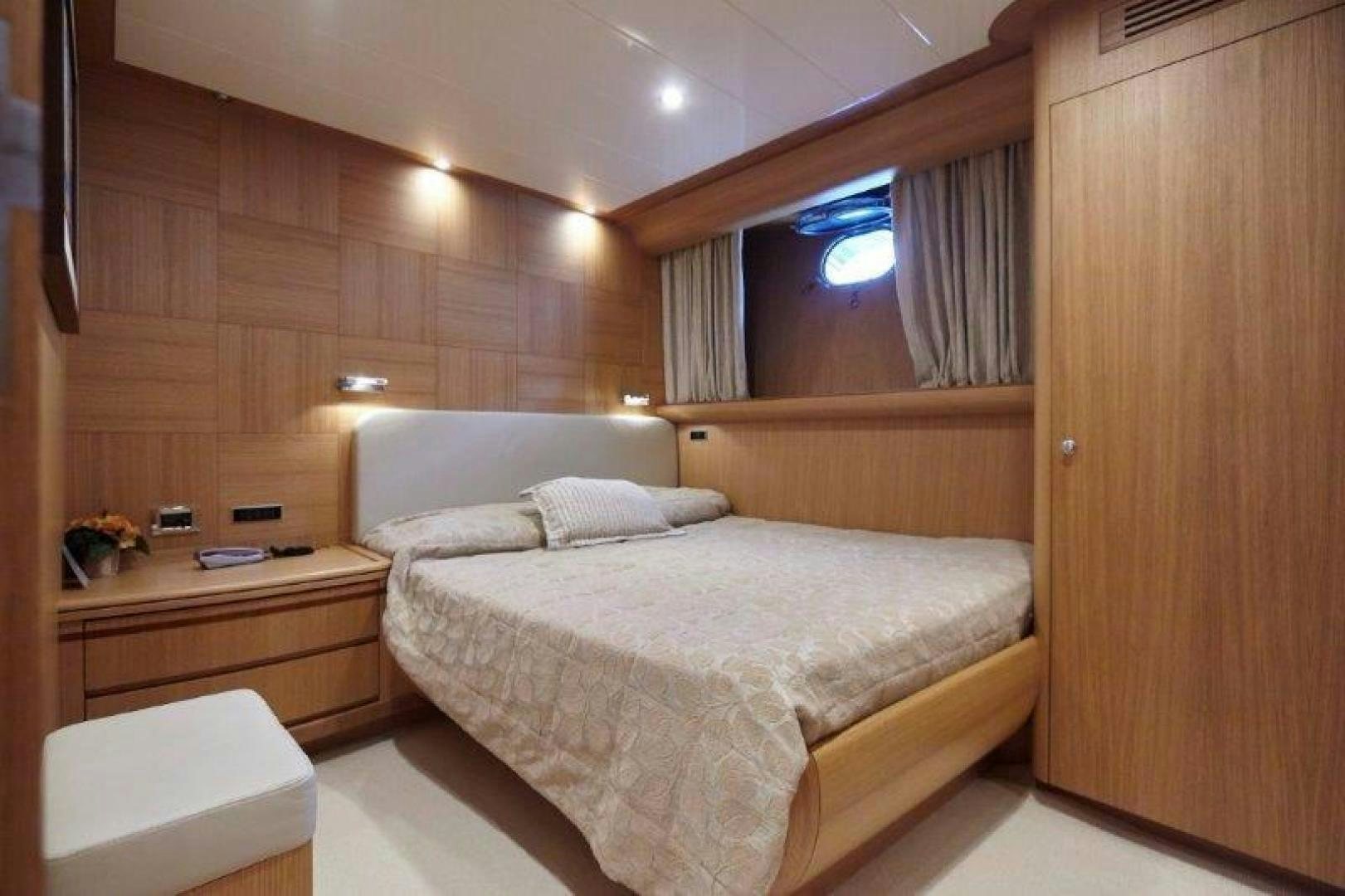 a room with a bed and a desk aboard YASSON Yacht for Sale