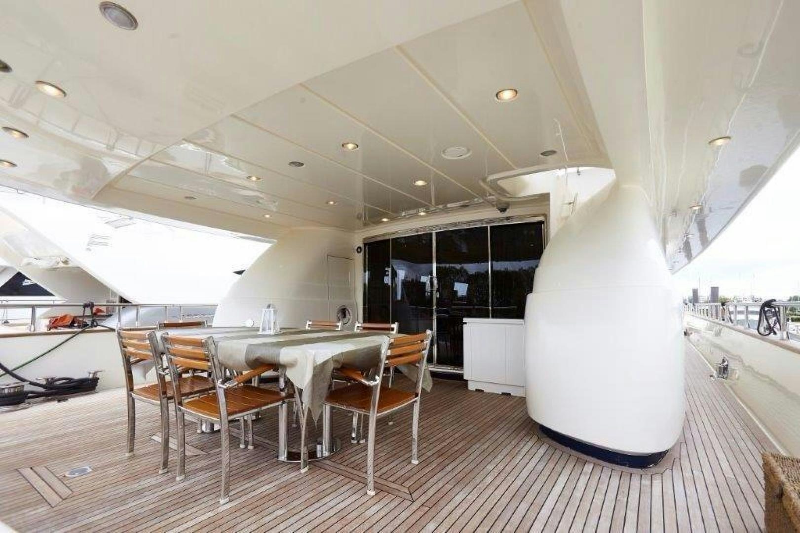 a room with tables and chairs aboard YASSON Yacht for Sale