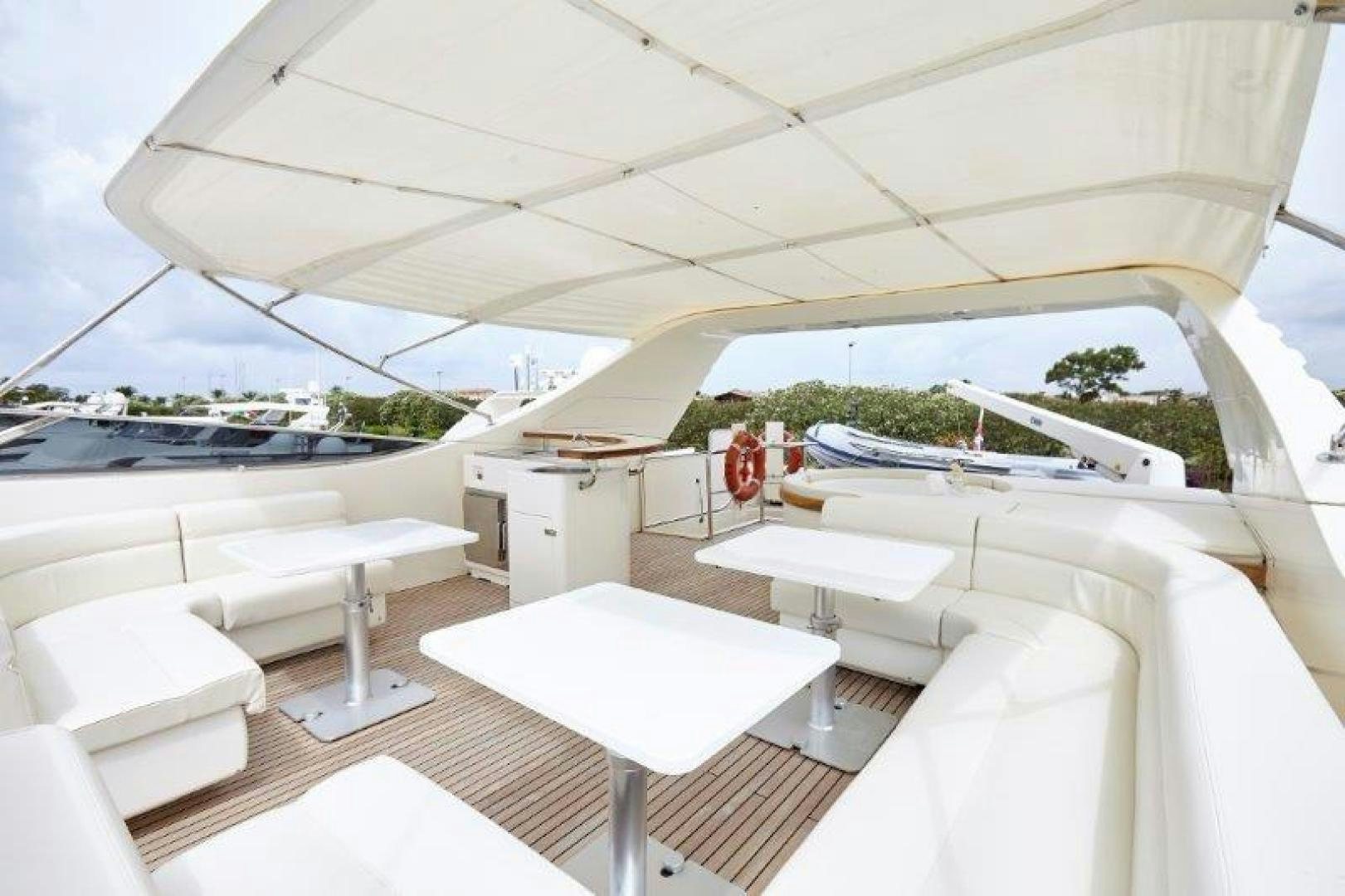 a room with white chairs and tables aboard YASSON Yacht for Sale