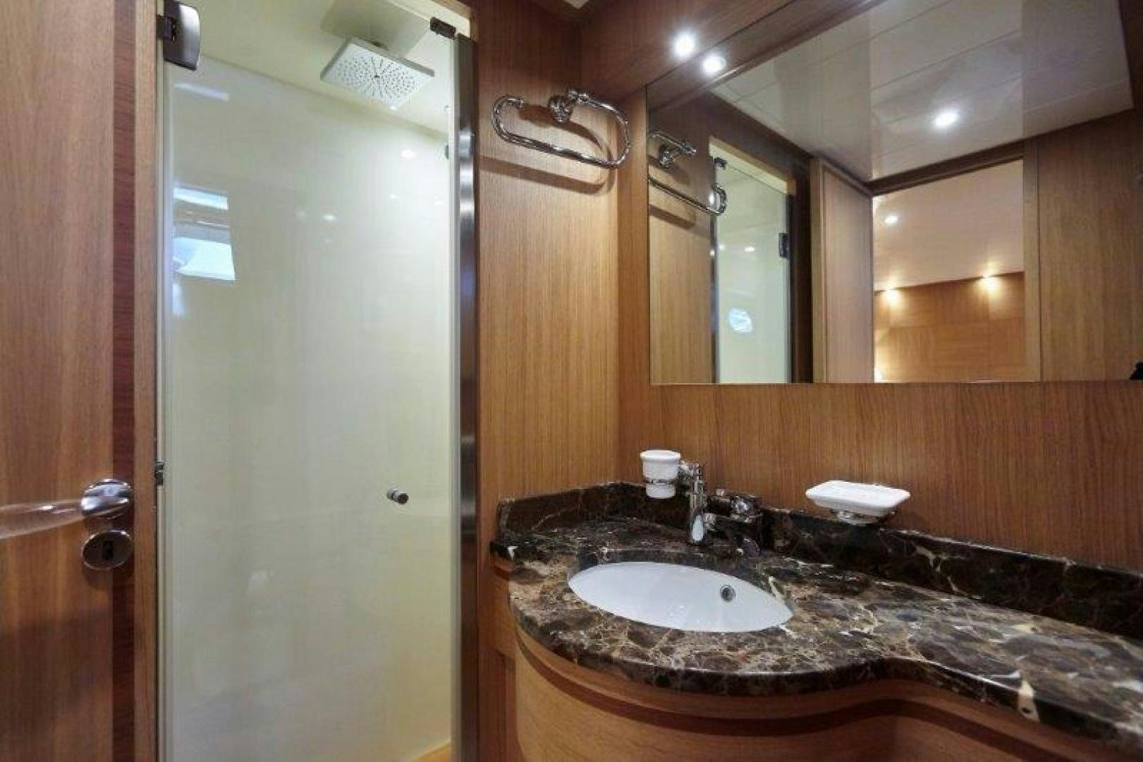 a bathroom with a marble countertop aboard YASSON Yacht for Sale