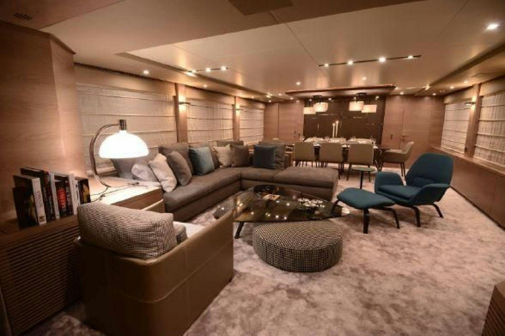 a living room with a couch and a coffee table aboard No Name Yacht for Sale