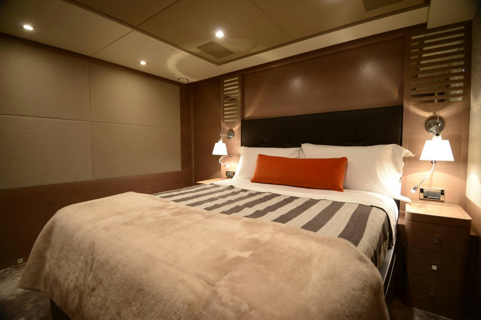 a hotel room with a bed and a lamp aboard No Name Yacht for Sale