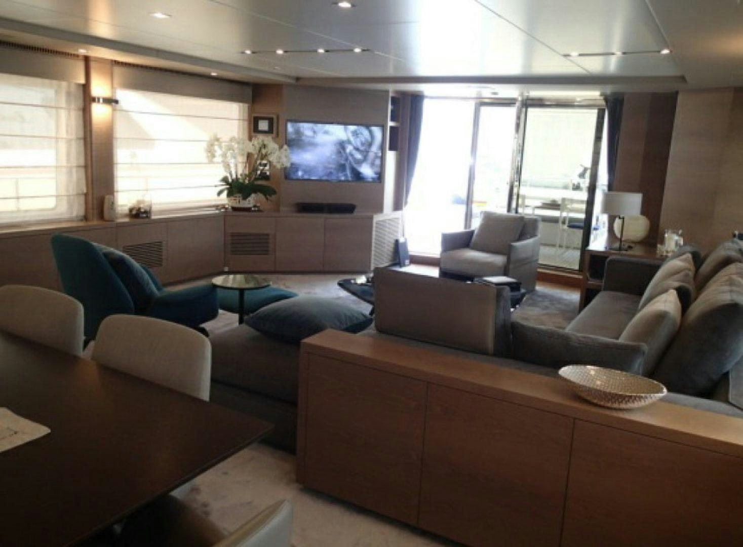a living room with a large tv aboard No Name Yacht for Sale