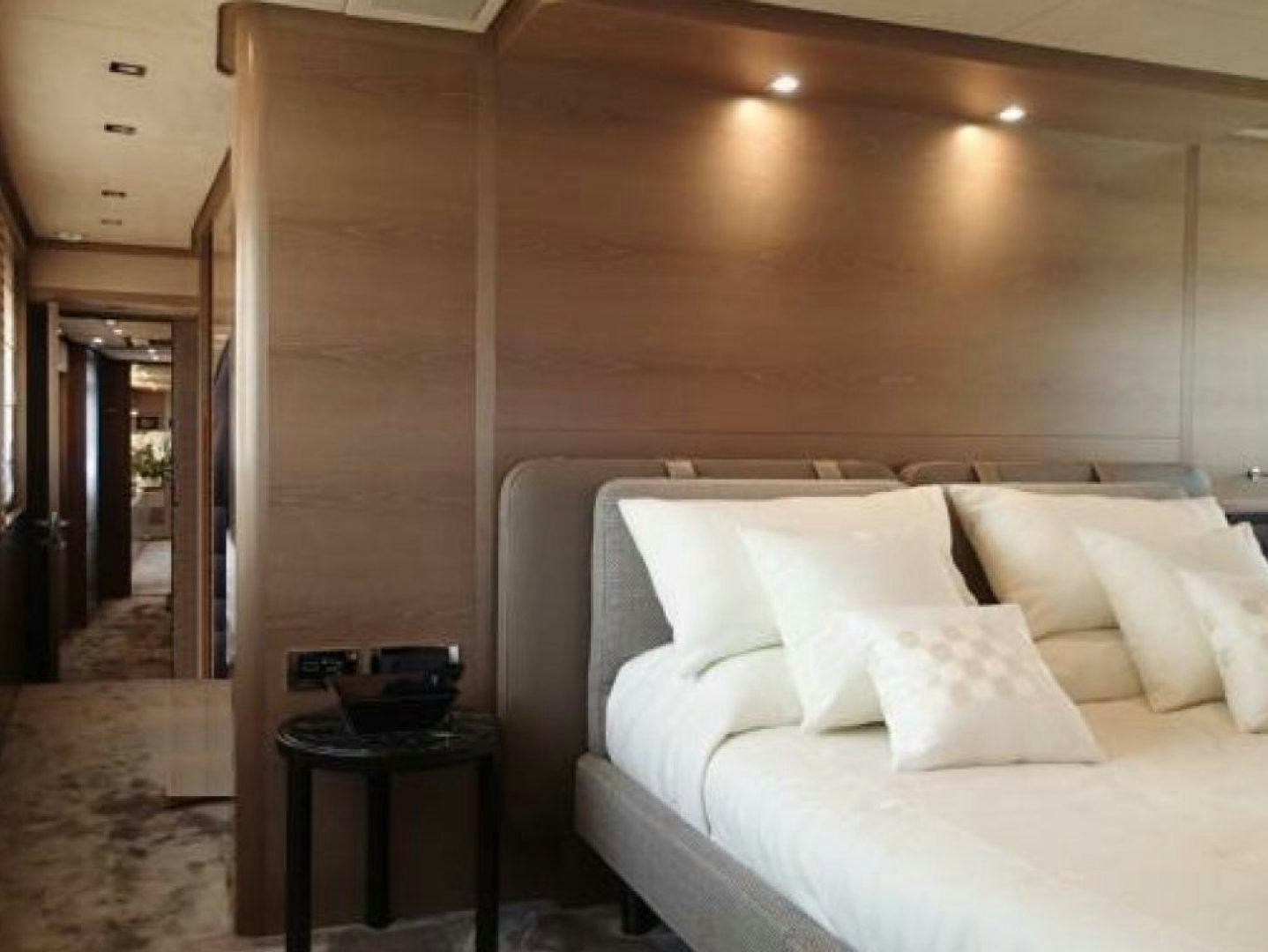 a bed with white sheets aboard No Name Yacht for Sale