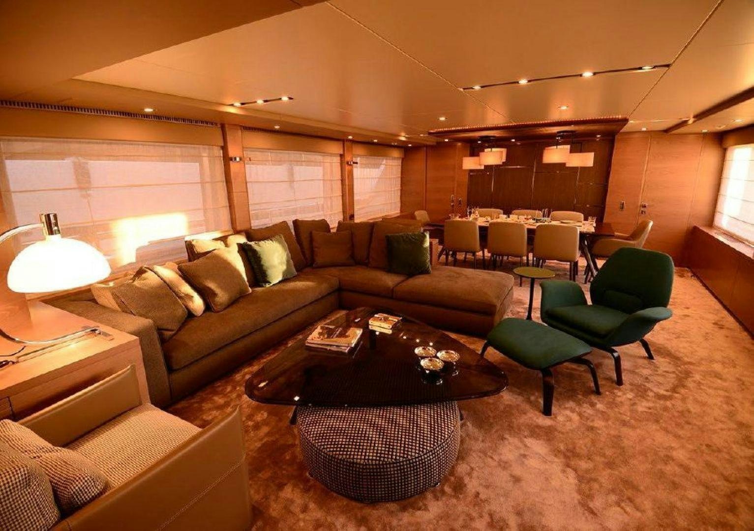 a living room with a couch and a coffee table aboard No Name Yacht for Sale