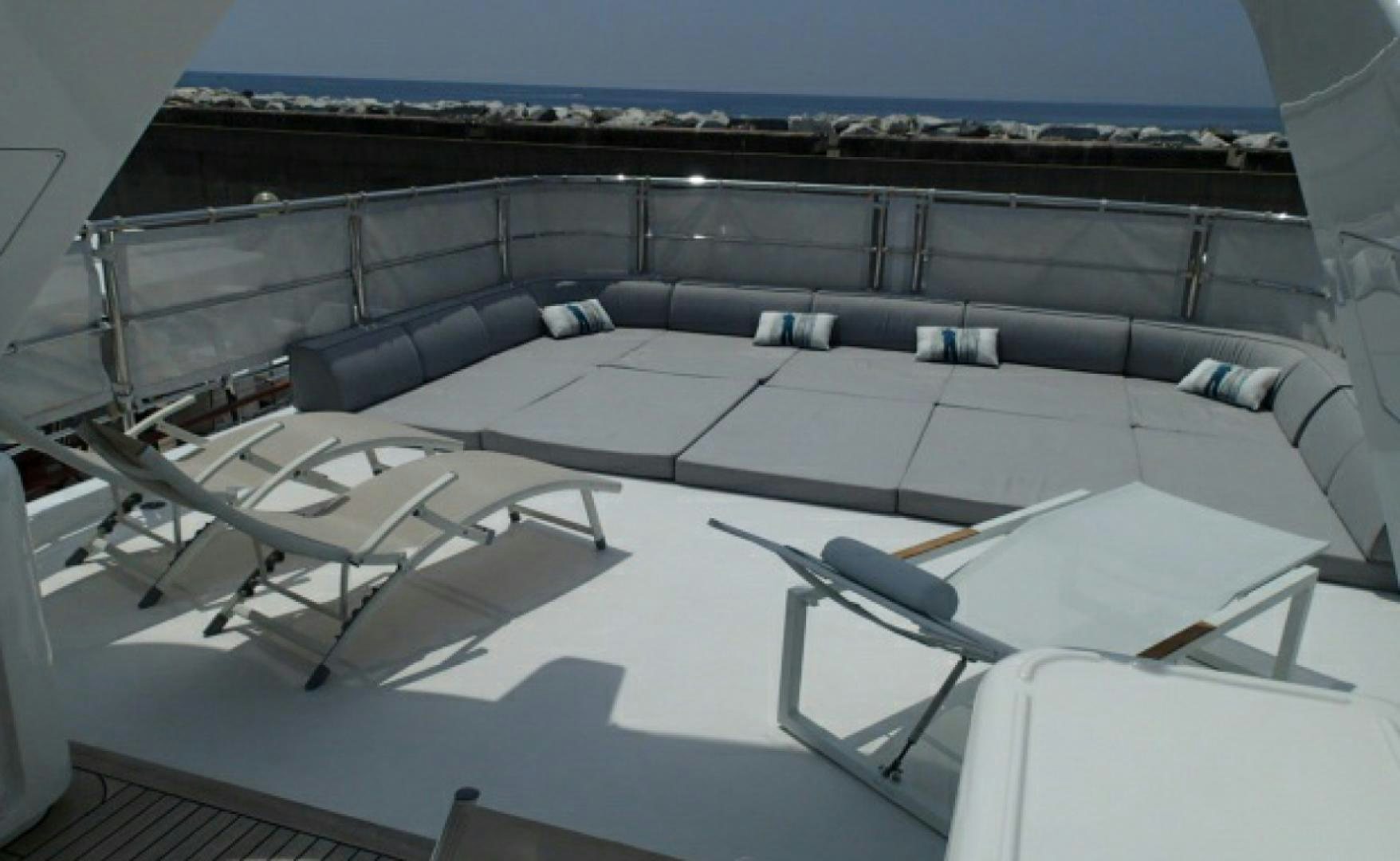 a large room with a balcony aboard No Name Yacht for Sale