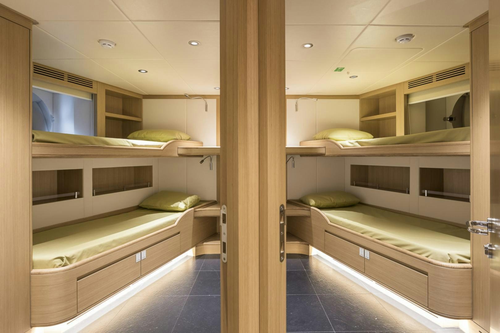 a room with bunk beds aboard MAJESTY 100 Yacht for Sale