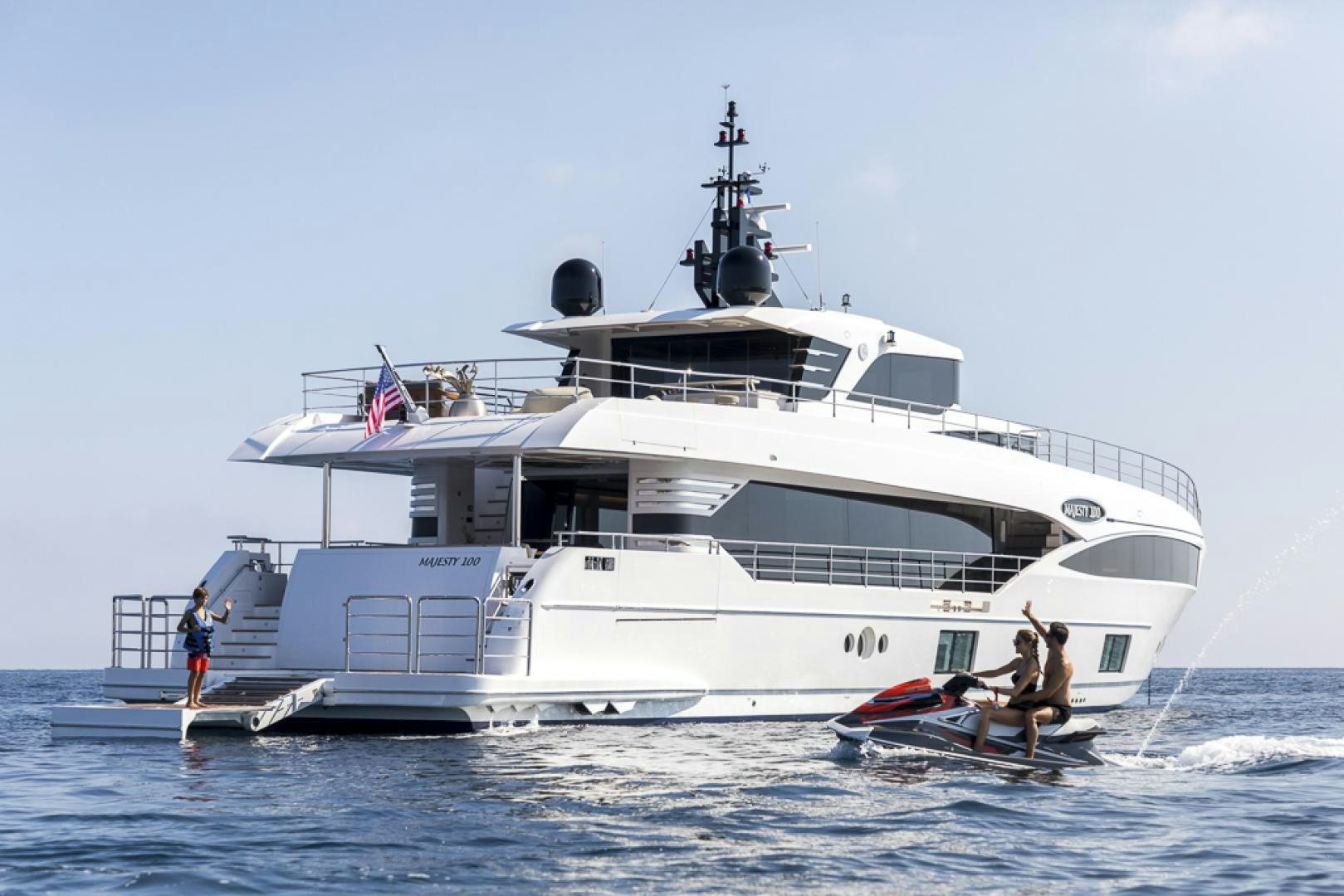 a large white boat with a person on it aboard MAJESTY 100 Yacht for Sale