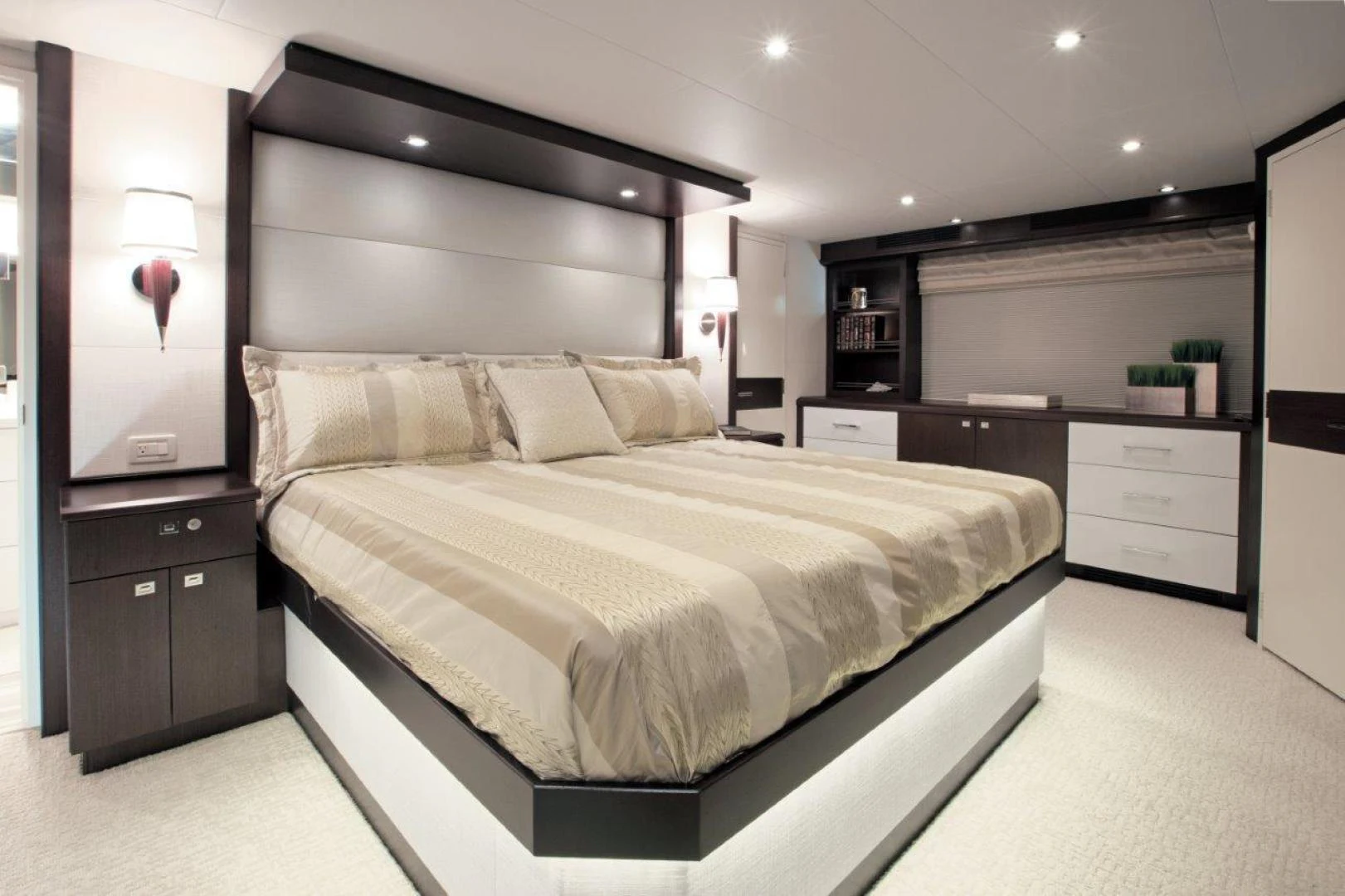 a large bed in a room aboard 105 RAISED PILOTHOUSE Yacht for Sale