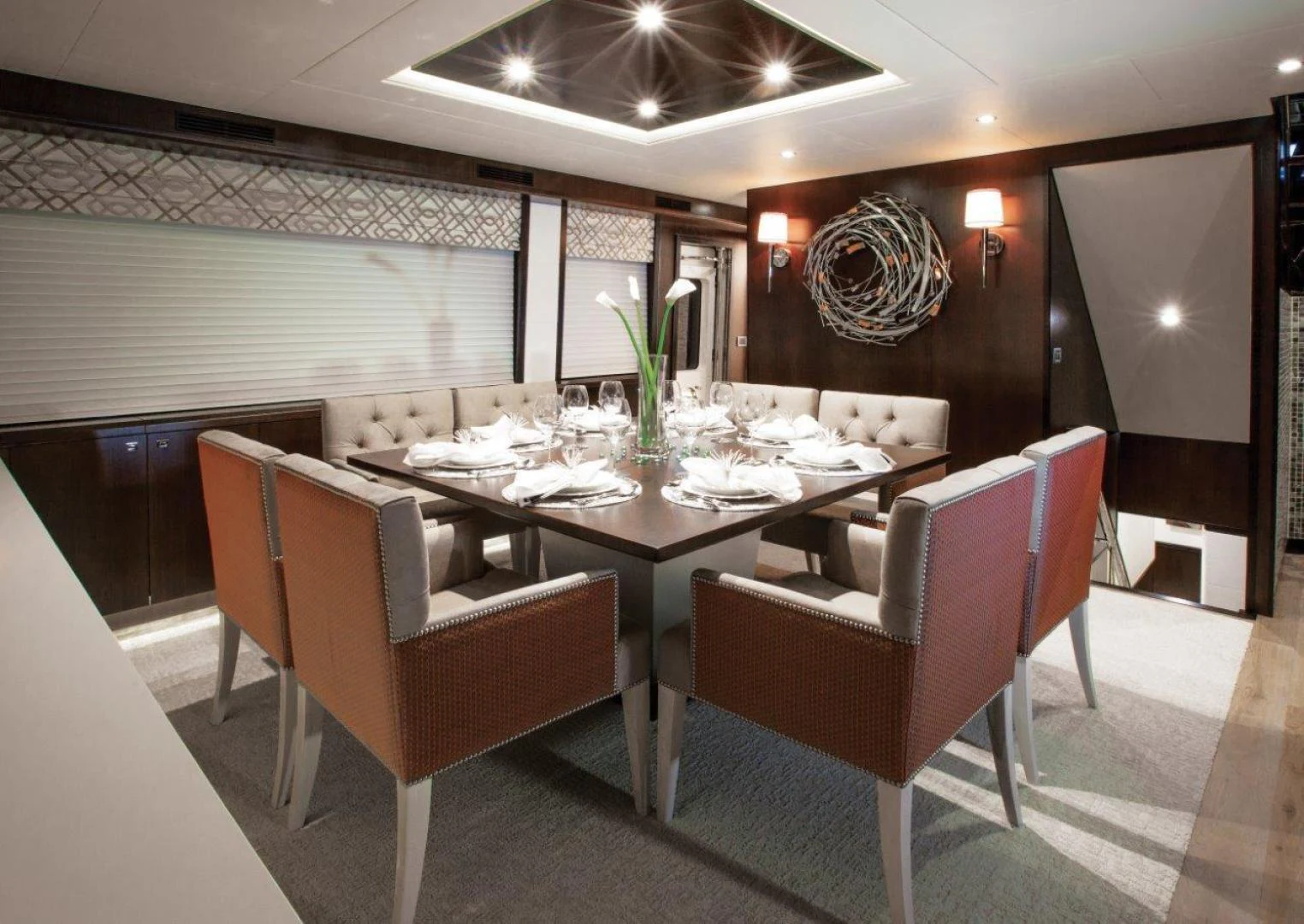 a dining room with a table and chairs aboard 105 RAISED PILOTHOUSE Yacht for Sale