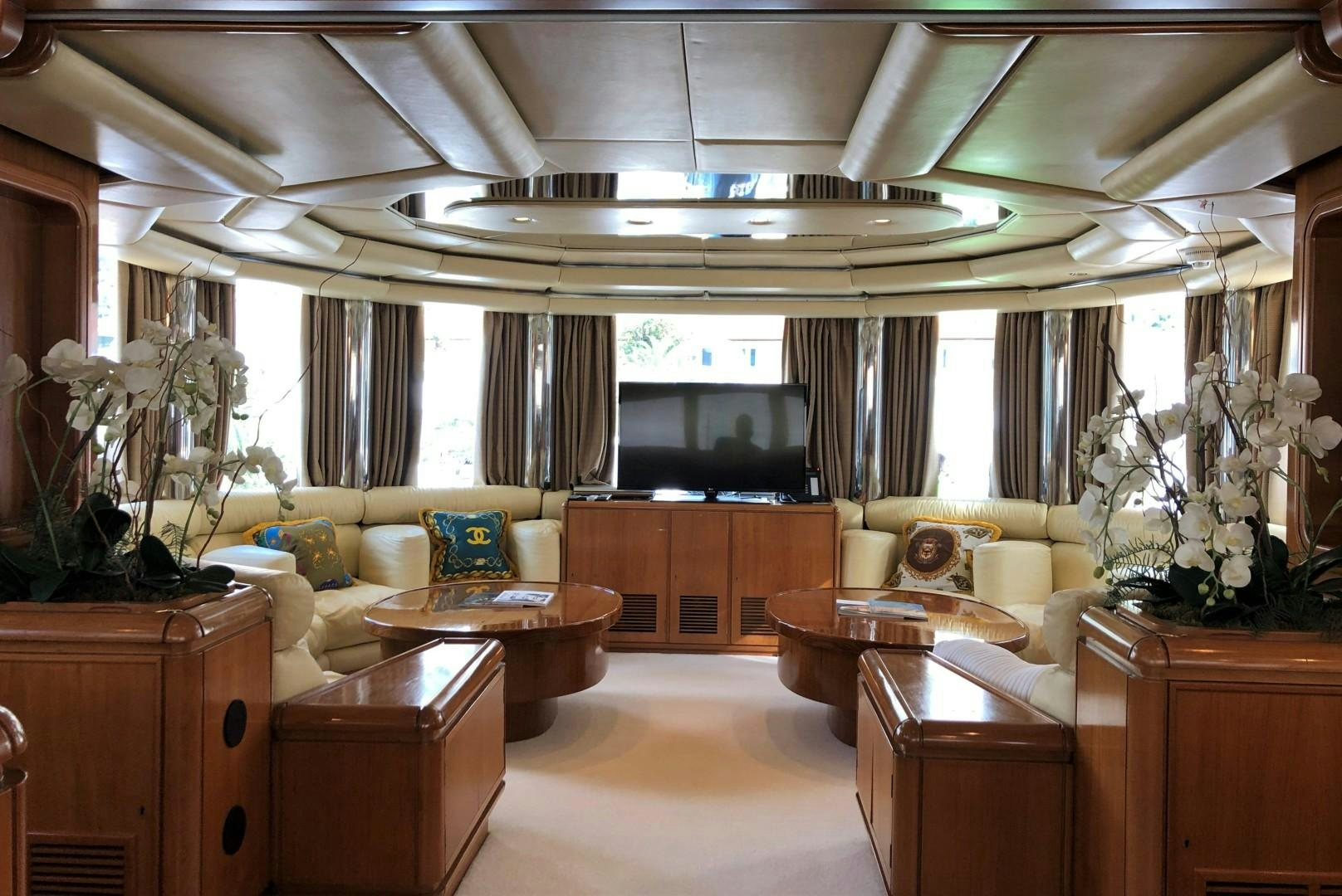 a living room with a large chandelier aboard NO NAME Yacht for Sale