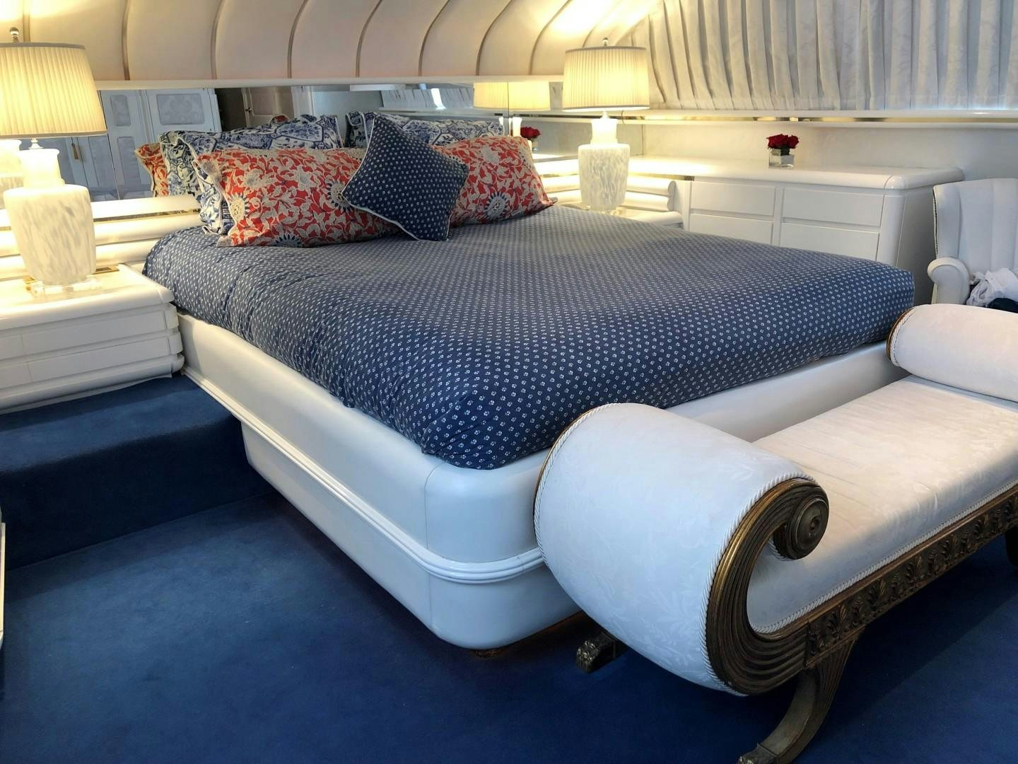 a bed with a blue and red blanket aboard NO NAME Yacht for Sale