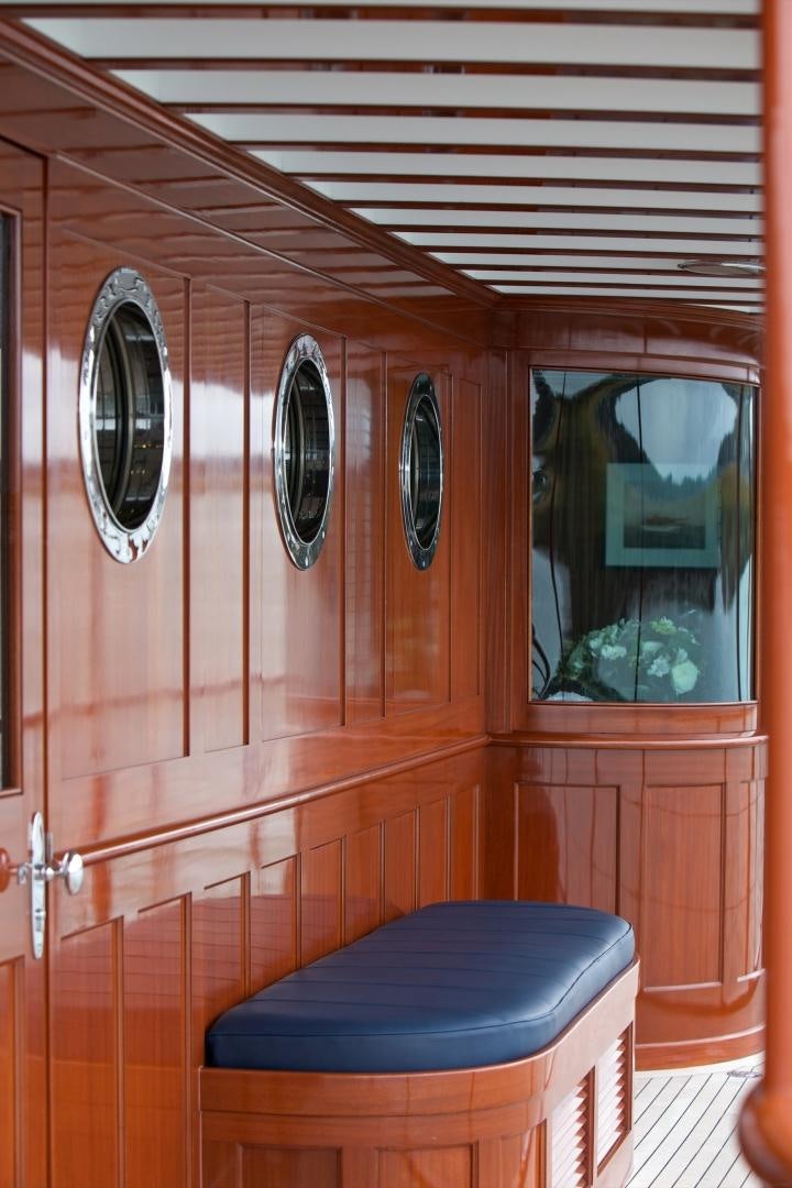 a bathroom with a round mirror aboard FREEDOM Yacht for Sale