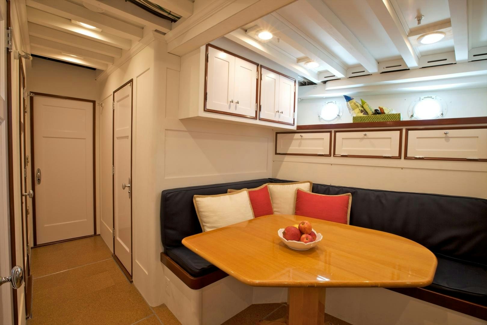 a room with a couch and a table aboard FREEDOM Yacht for Sale