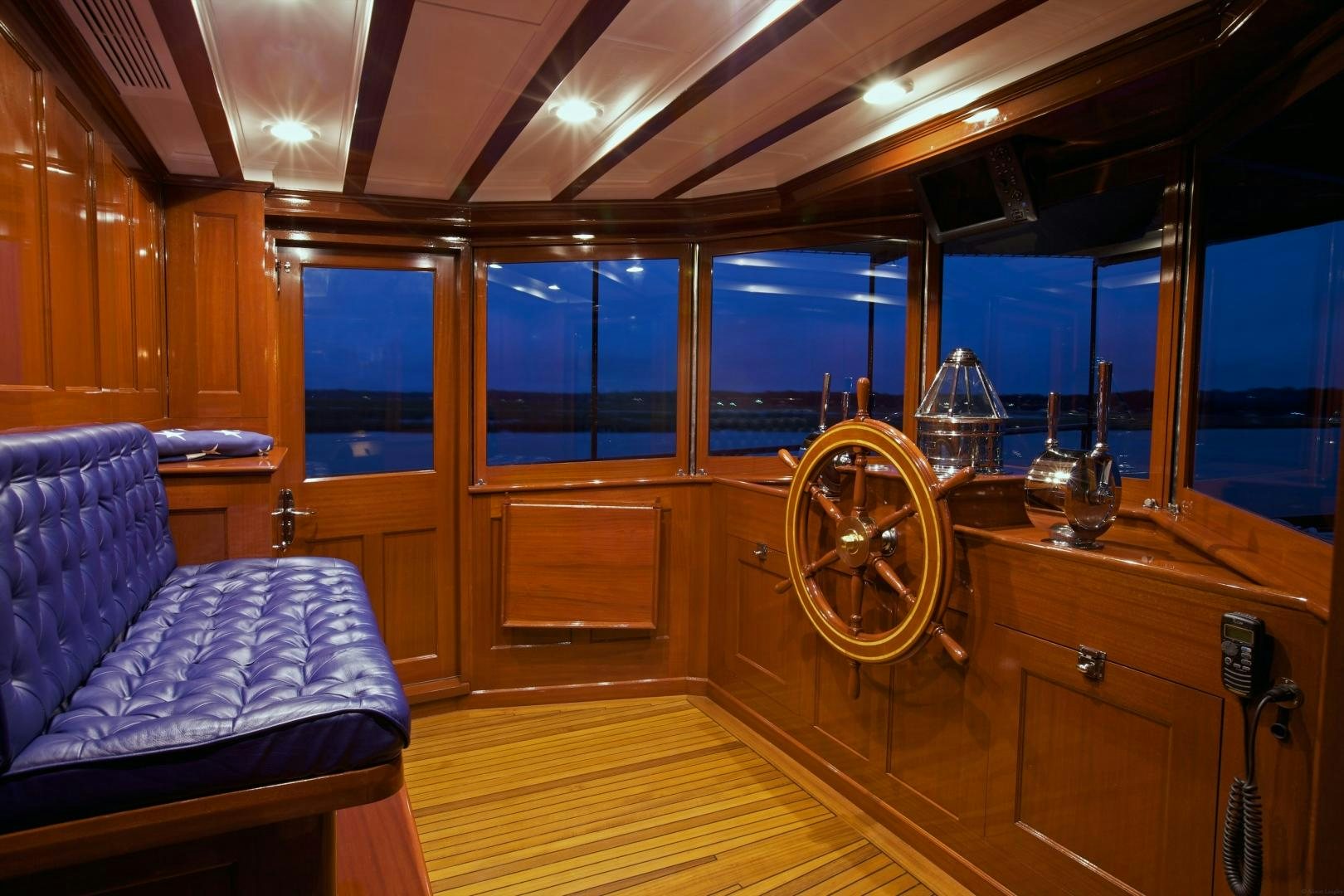 a room with a large mirror and a couch aboard FREEDOM Yacht for Sale