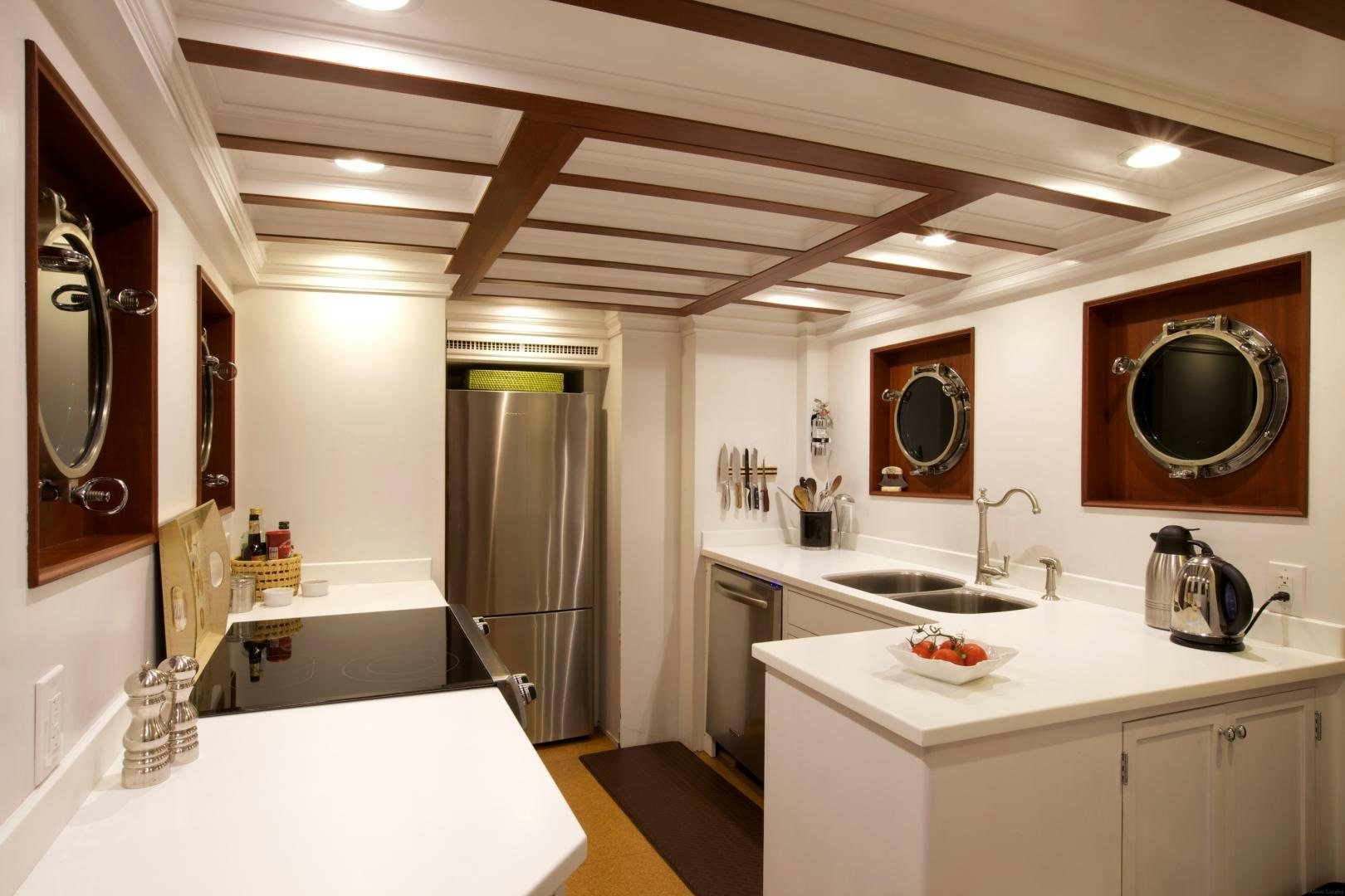 a kitchen with a sink and a refrigerator aboard FREEDOM Yacht for Sale