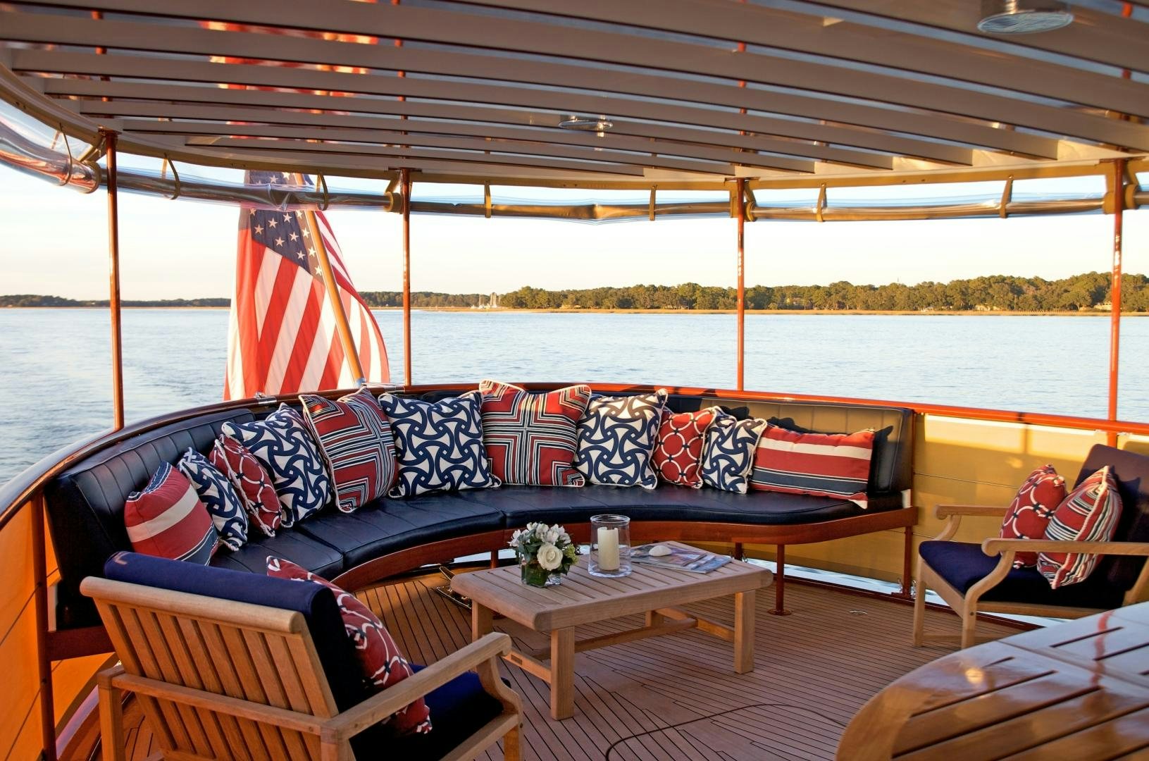 a couch and table on a boat aboard FREEDOM Yacht for Sale