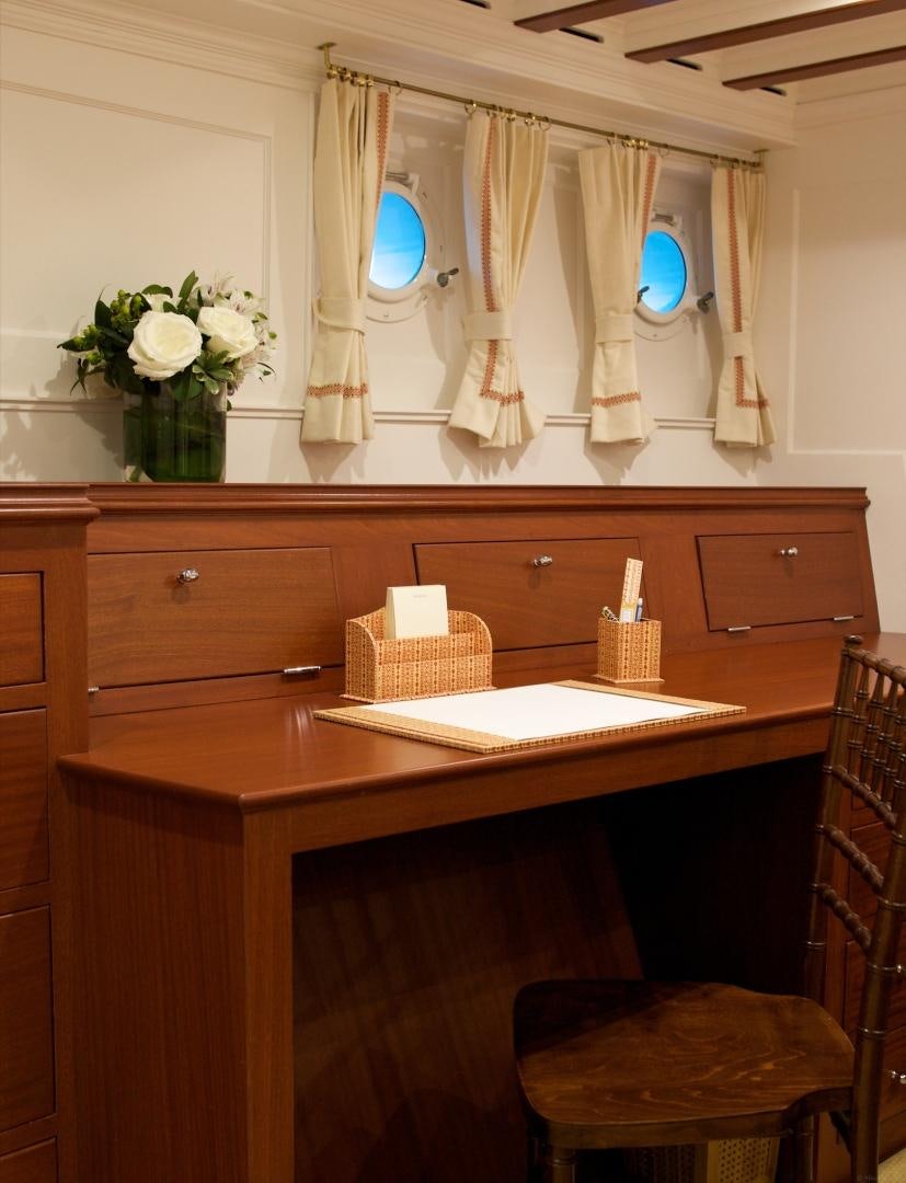 a bathroom with a countertop sink and mirror aboard FREEDOM Yacht for Sale
