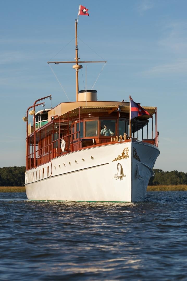 a large boat in the water aboard FREEDOM Yacht for Sale