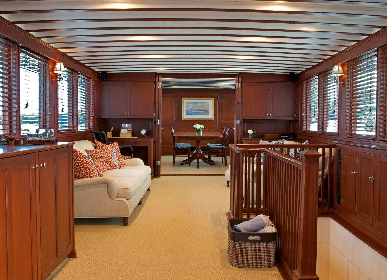 a living room with a couch and a table aboard FREEDOM Yacht for Sale