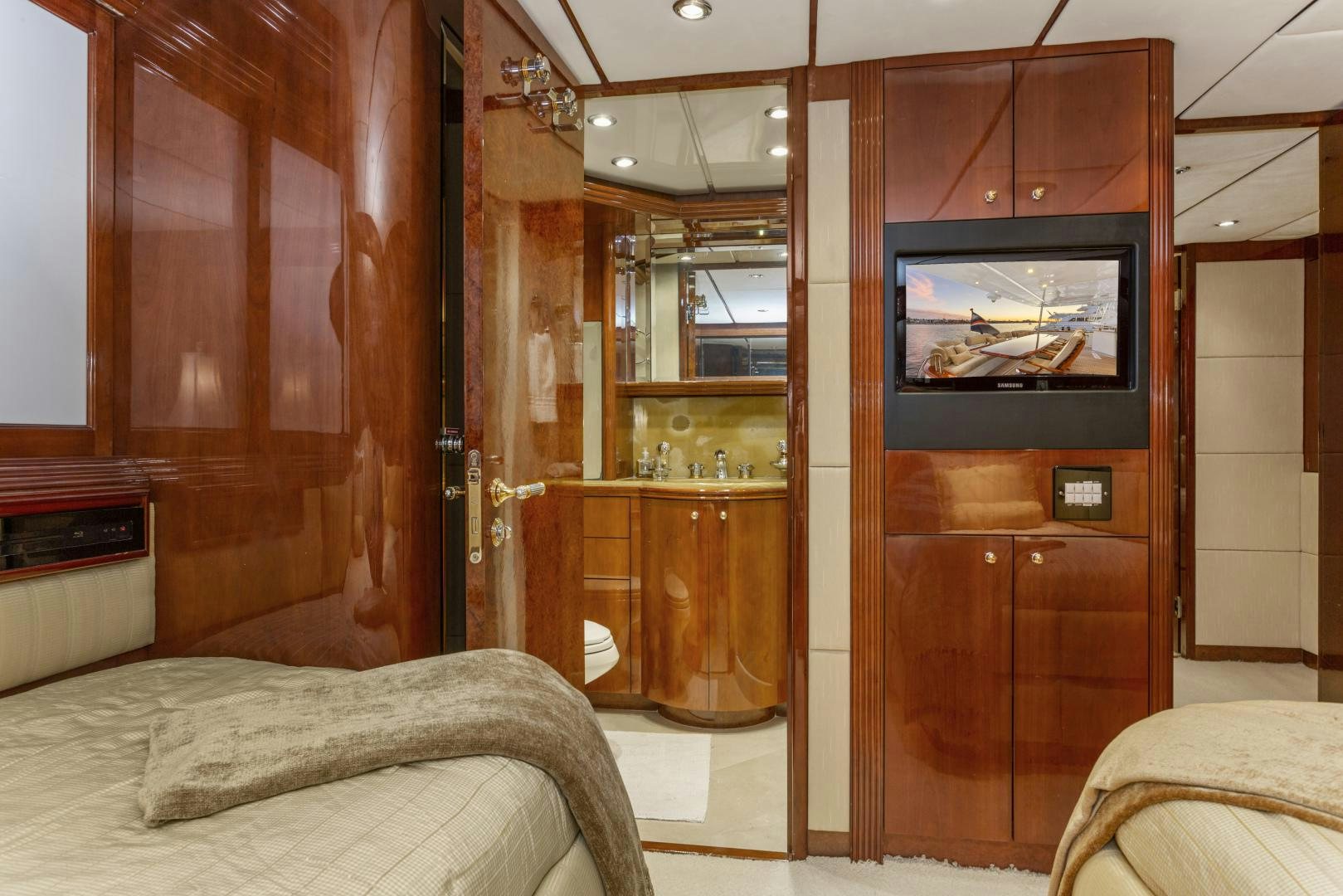 a room with a bed and a tv aboard ANA’S INSPIRATION Yacht for Sale