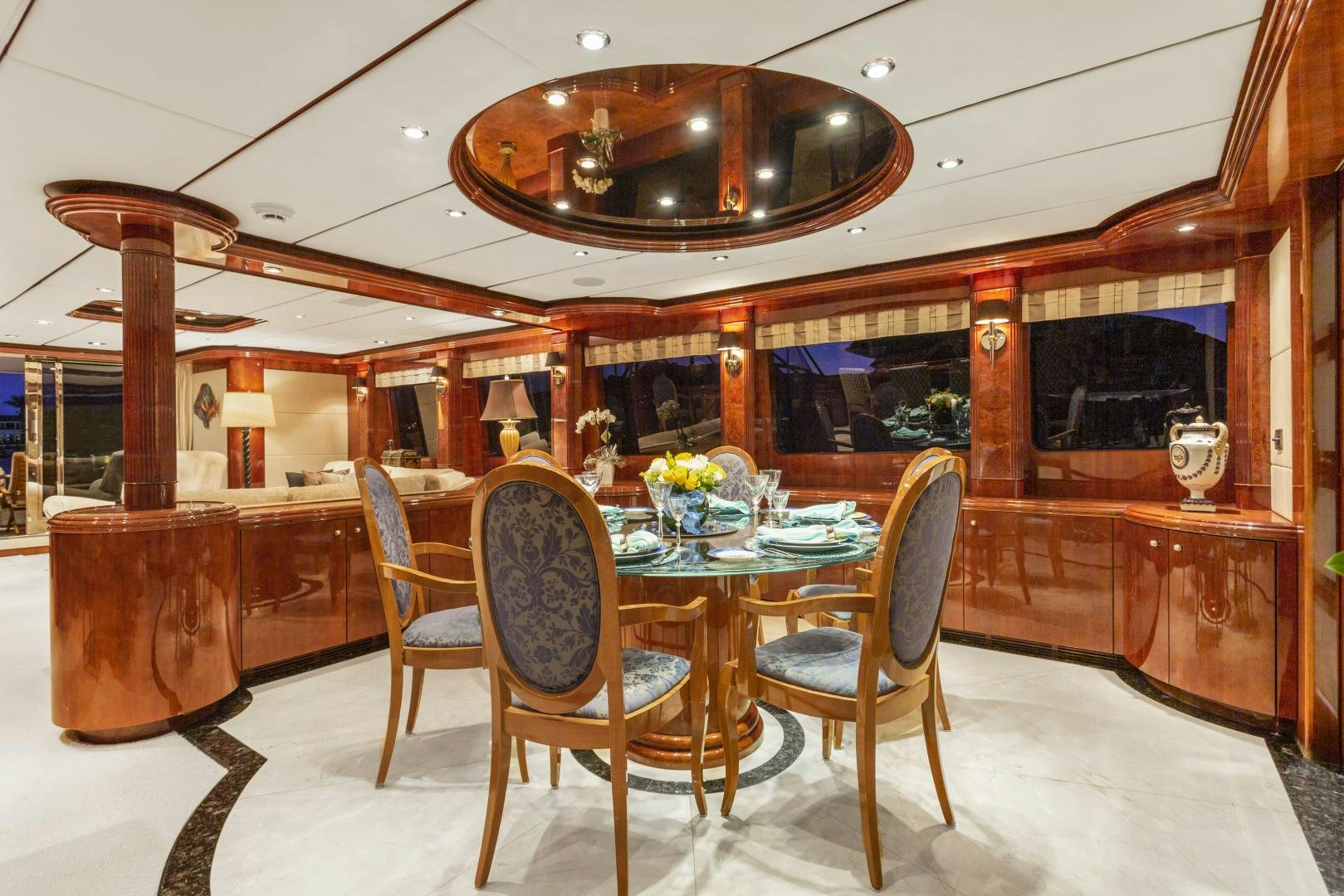 a dining room with a table and chairs aboard ANA’S INSPIRATION Yacht for Sale