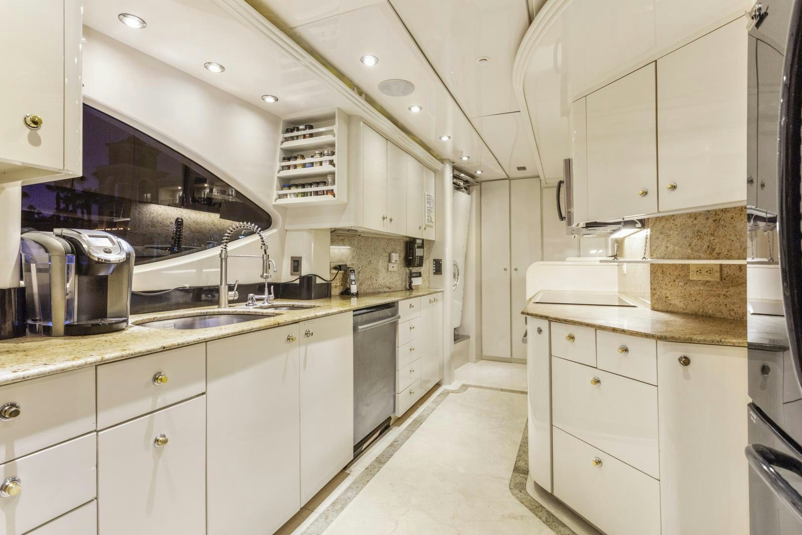 a kitchen with white cabinets aboard ANA’S INSPIRATION Yacht for Sale