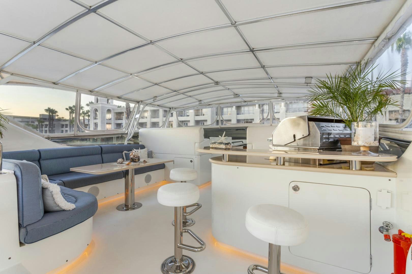 a room with a desk and chairs aboard ANA’S INSPIRATION Yacht for Sale