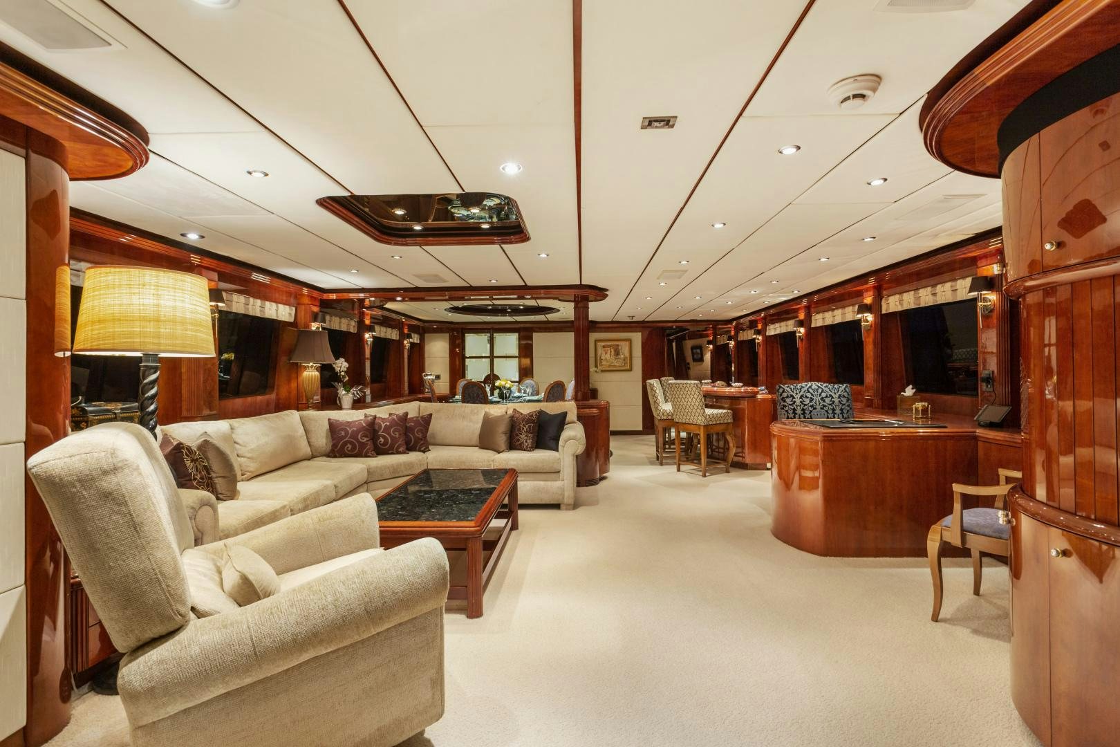 a living room with a couch and a table aboard ANA’S INSPIRATION Yacht for Sale