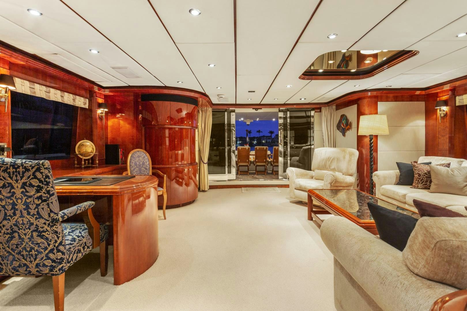 a living room with a large glass door aboard ANA’S INSPIRATION Yacht for Sale