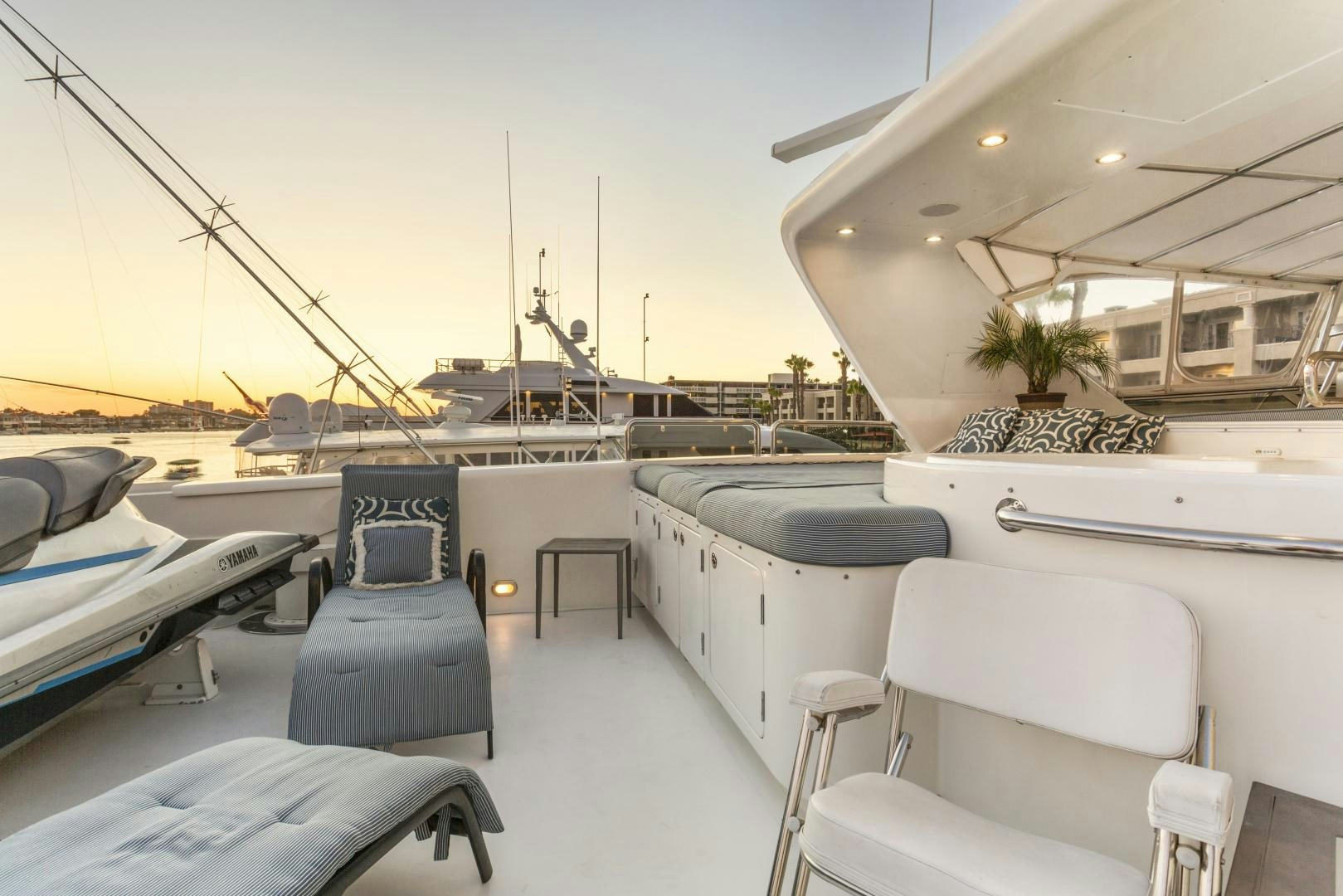 a boat dock with chairs and tables aboard ANA’S INSPIRATION Yacht for Sale